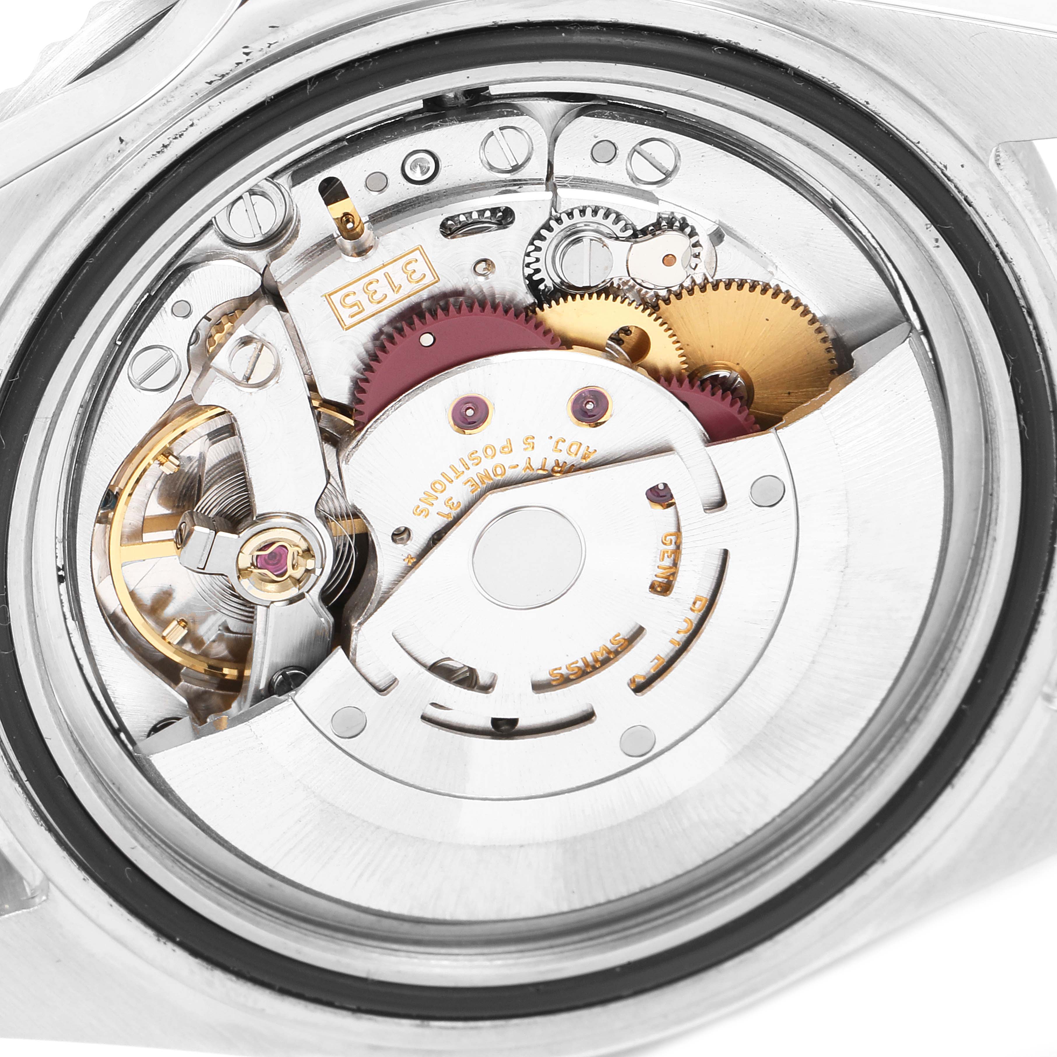 The image shows the internal mechanism of a Rolex Submariner 16610 Men
s Stainless Steel Black Dial 16610 Men
s Stainless Steel Black Dial watch from a close-up back angle.