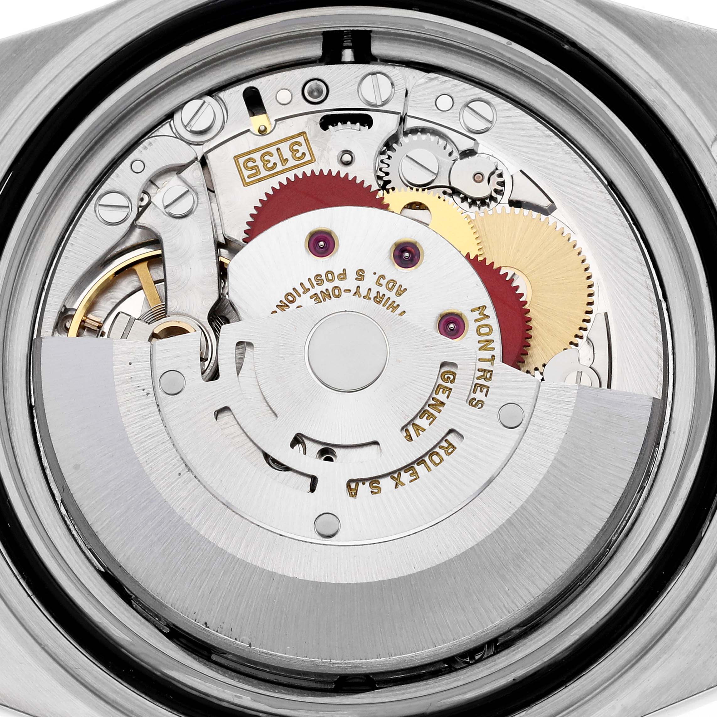 This image shows the movement mechanism of a Rolex Submariner 16613 Men's Steel and Gold (two tone) Blue Dial 16613 Men's Steel and Gold (two tone) Blue Dial watch, viewed from the back with its intricate gears and rotor.