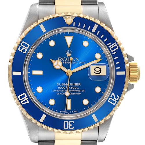 The image shows a front view of a Rolex Submariner watch, featuring a blue dial, gold accents, and a date display at 3 o'clock.