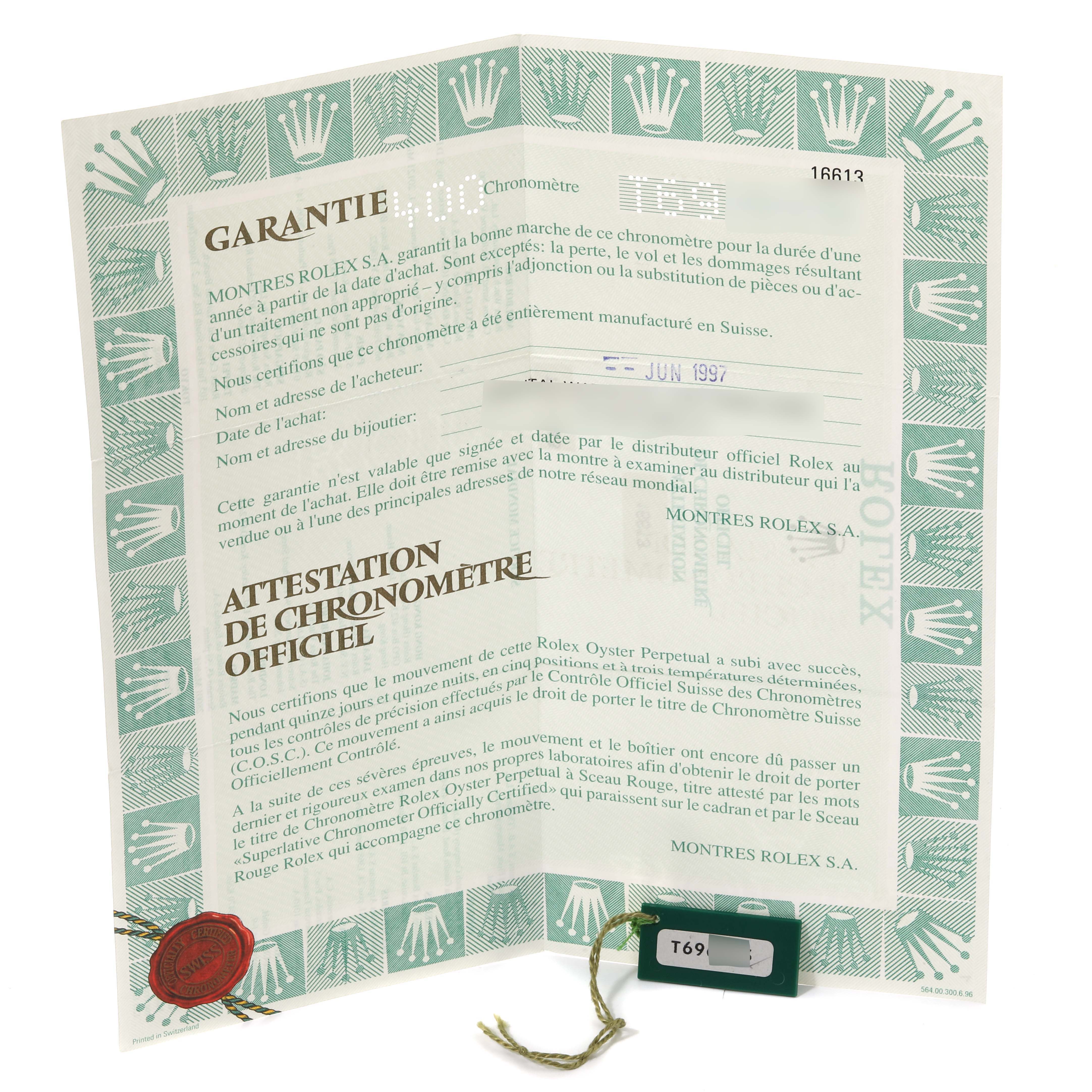 The image shows the warranty and certification papers of the Rolex Submariner 16613 Men's Steel and Gold (two tone) Blue Dial 16613 Men's Steel and Gold (two tone) Blue Dial model.