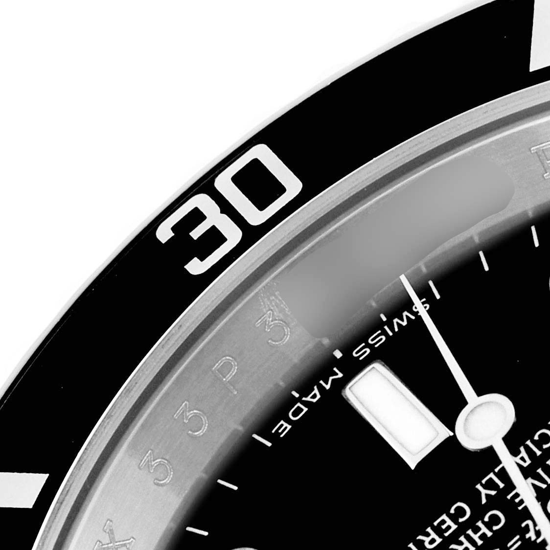 Close-up of a Rolex Submariner 16610 Men's Stainless Steel Black Dial 16610 Men's Stainless Steel Black Dial watch showing the bezel with the "30" mark, part of the dial, and a single hand.