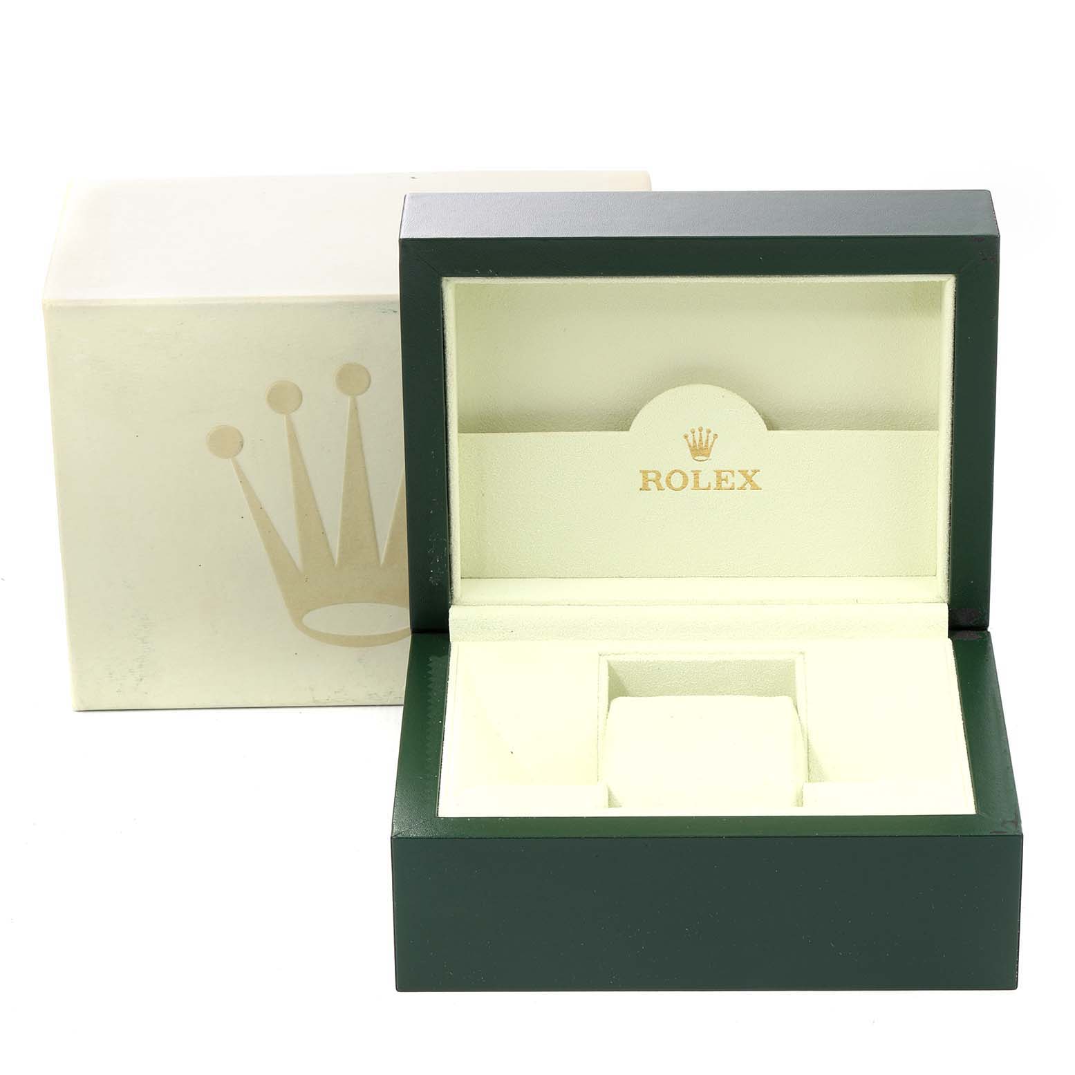 The image shows an open green and beige Rolex Submariner 16610LV Men
s Stainless Steel Black Dial 16610LV Men
s Stainless Steel Black Dial watch box with a closed outer cardboard box beside it.