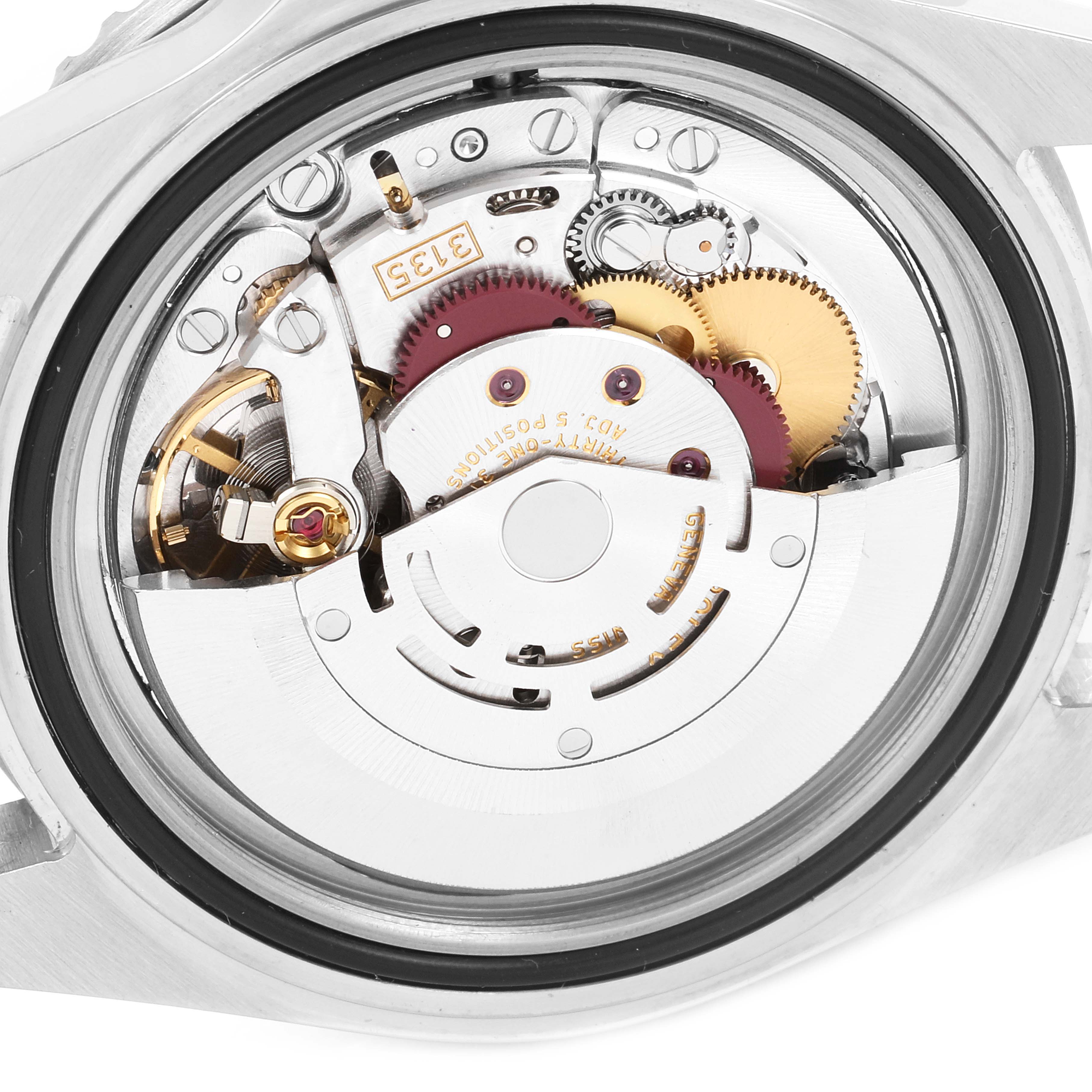 The image shows the internal mechanism of the Rolex Submariner 16610LV Men
s Stainless Steel Black Dial 16610LV Men
s Stainless Steel Black Dial watch, focusing on the movement from a rear, open-case angle.