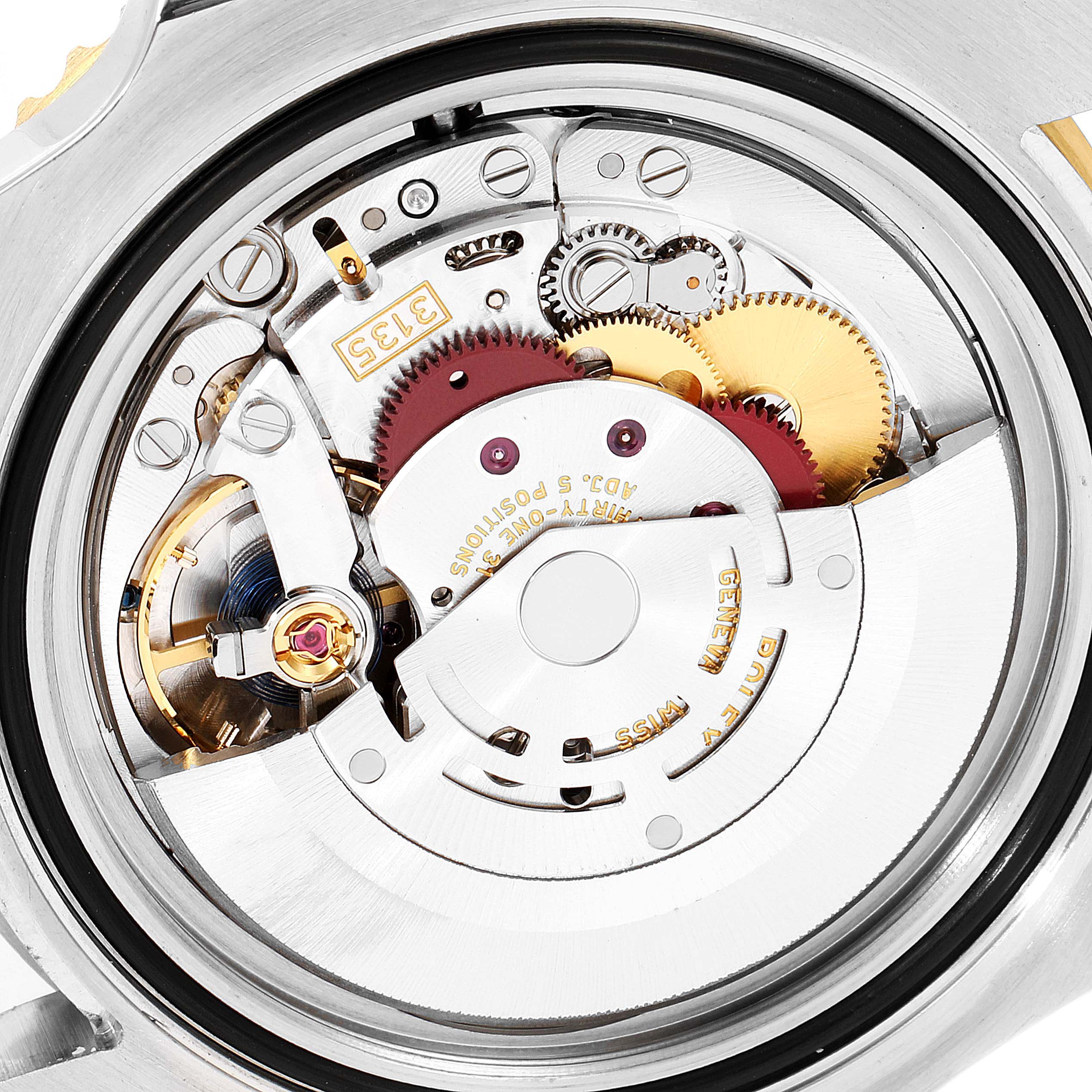 This image shows a close-up view of the mechanical movement parts of a Rolex Submariner 116613 Men
s Steel and Gold (two tone) Black Dial 116613 Men
s Steel and Gold (two tone) Black Dial watch.