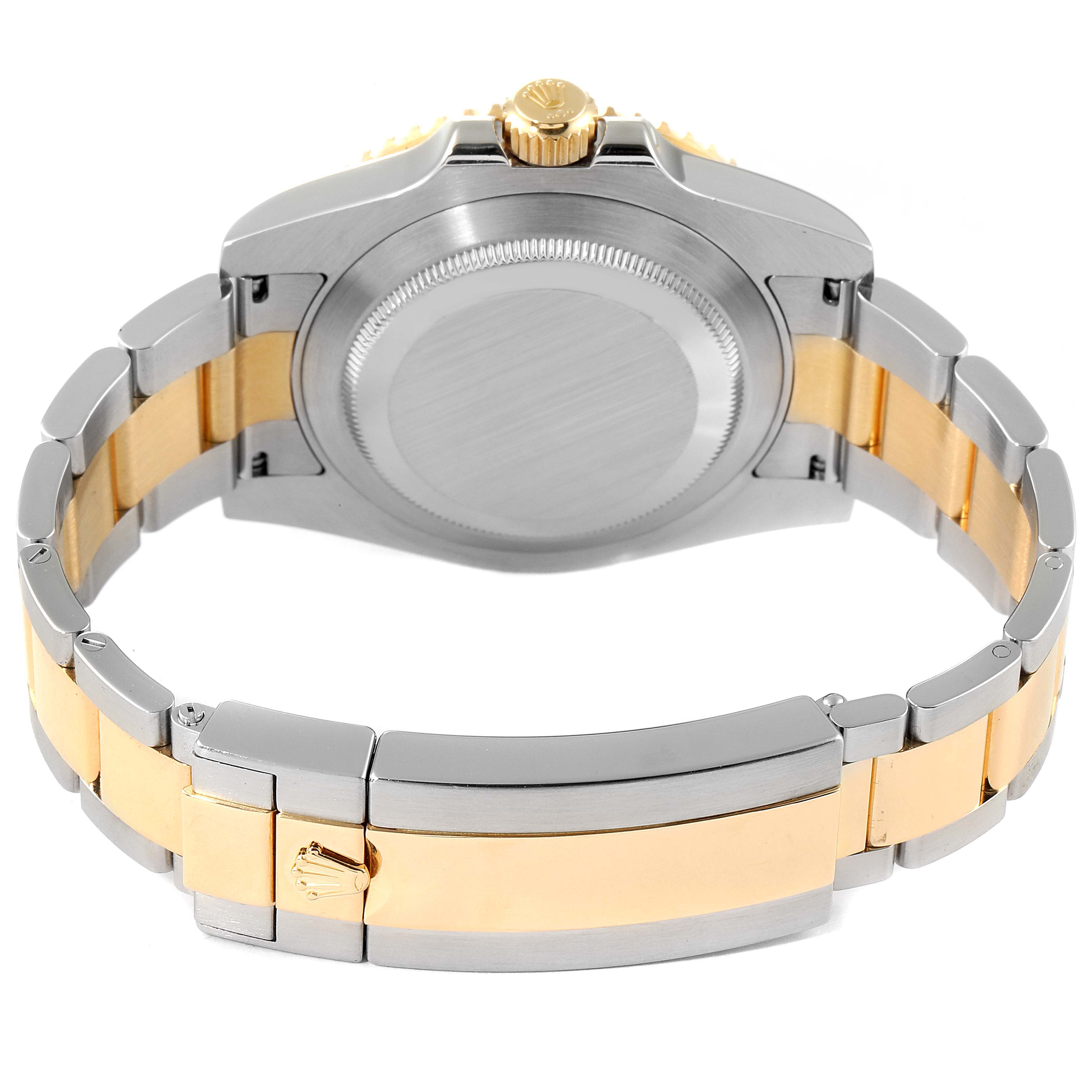 The image shows the case back and clasp of a Rolex Submariner 116613 Men
s Steel and Gold (two tone) Black Dial 116613 Men
s Steel and Gold (two tone) Black Dial watch, highlighting the bracelet links and crown.