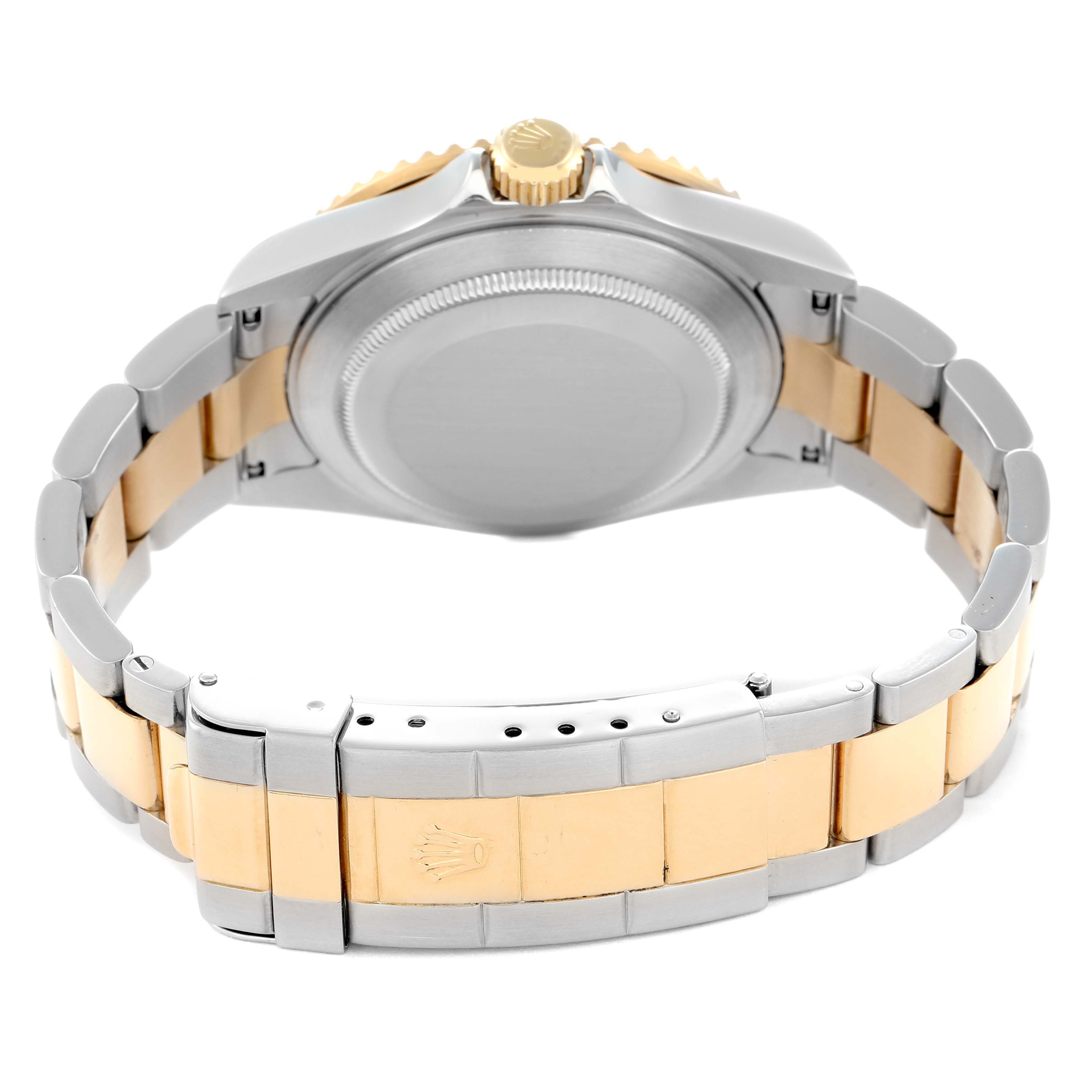 The image shows the back angle of a Rolex Submariner 16613 Men
s Steel and Gold (two tone) Grey Dial, highlighting the bracelet, clasp, and case back.