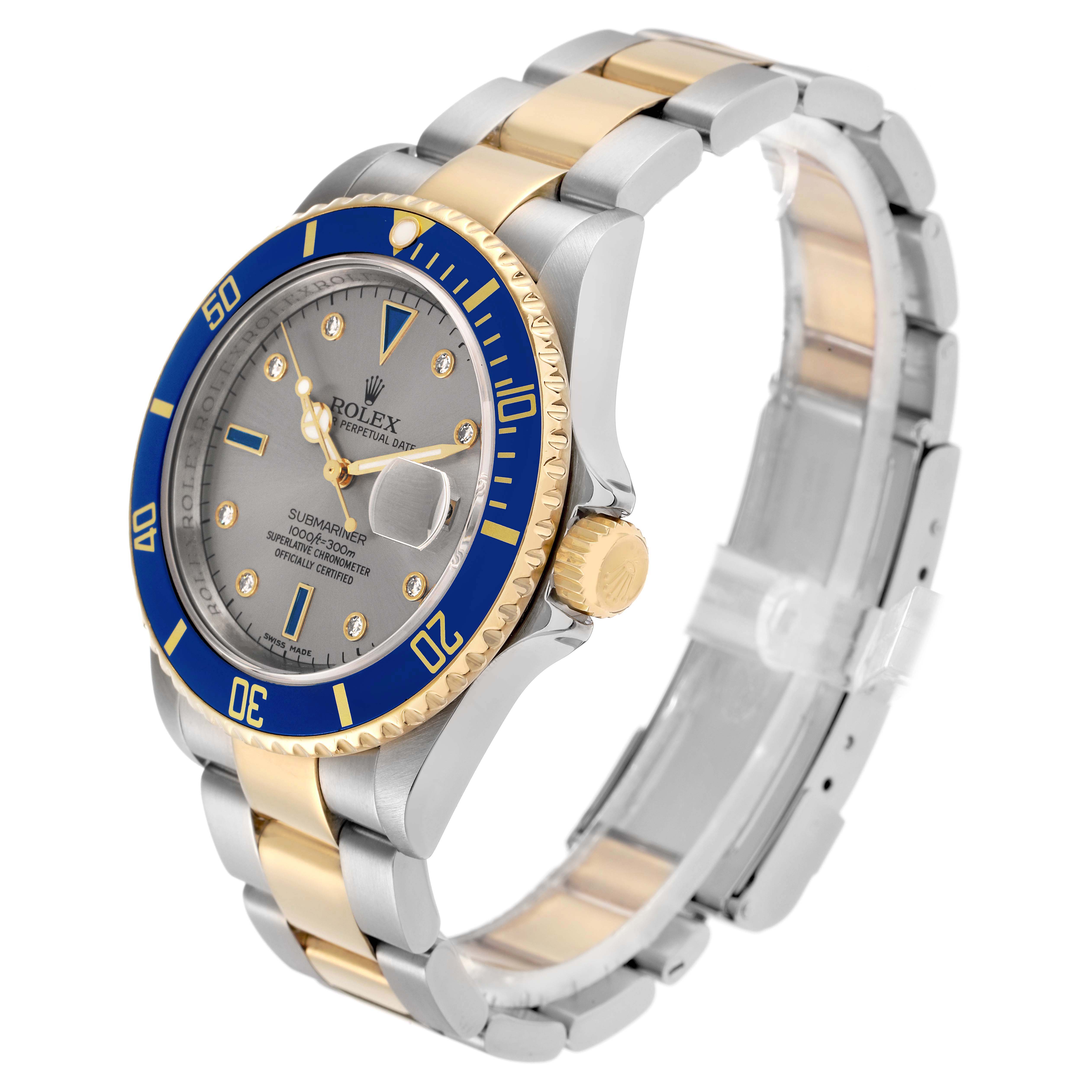 The Rolex Submariner 16613 Men
s Steel and Gold (two tone) Grey Dial watch is shown at a three-quarter angle, displaying the bracelet, bezel, dial, and crown.