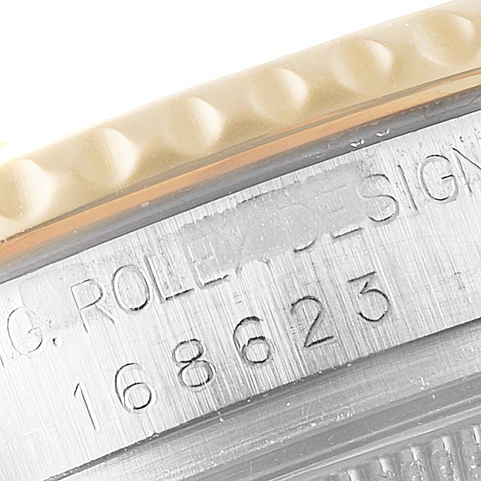 The close-up image shows the bezel and engraved serial number of a Rolex Yacht-Master 168623 Men
s Steel and Gold (two tone) White Dial 168623 Men
s Steel and Gold (two tone) White Dial watch.