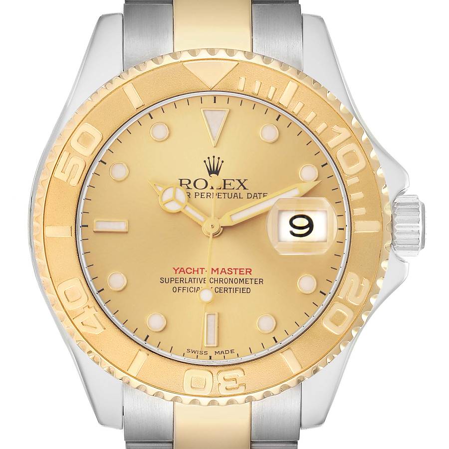 The image shows a frontal view of the Rolex Yacht-Master model 16623, featuring the gold bezel, dial, and part of the bracelet with the crown and date window visible.