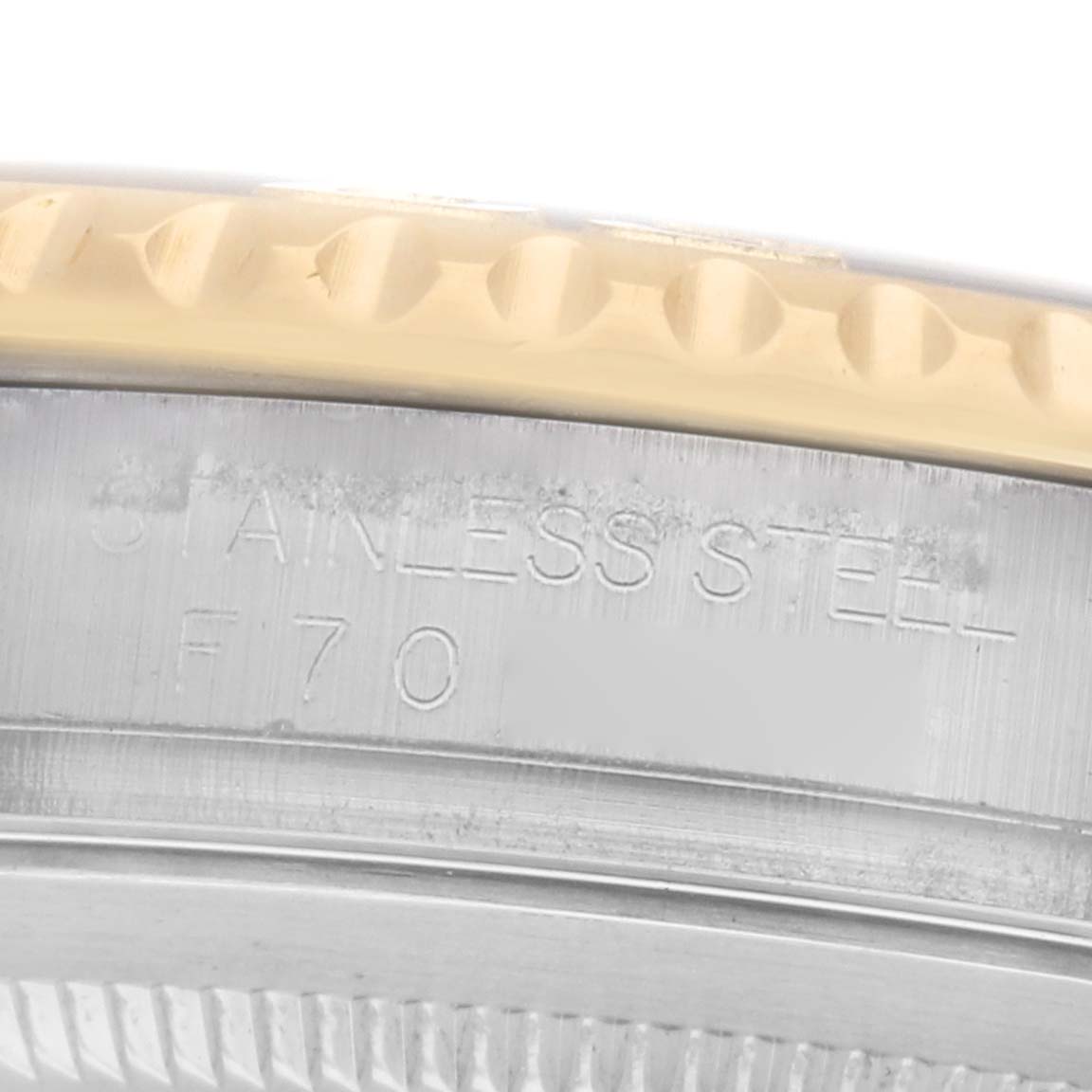 This image shows a close-up of the Rolex Yacht-Master 16623 Men
s Steel and Gold (two tone) Champagne Dial
s edge, focusing on the stainless steel and gold bezel.