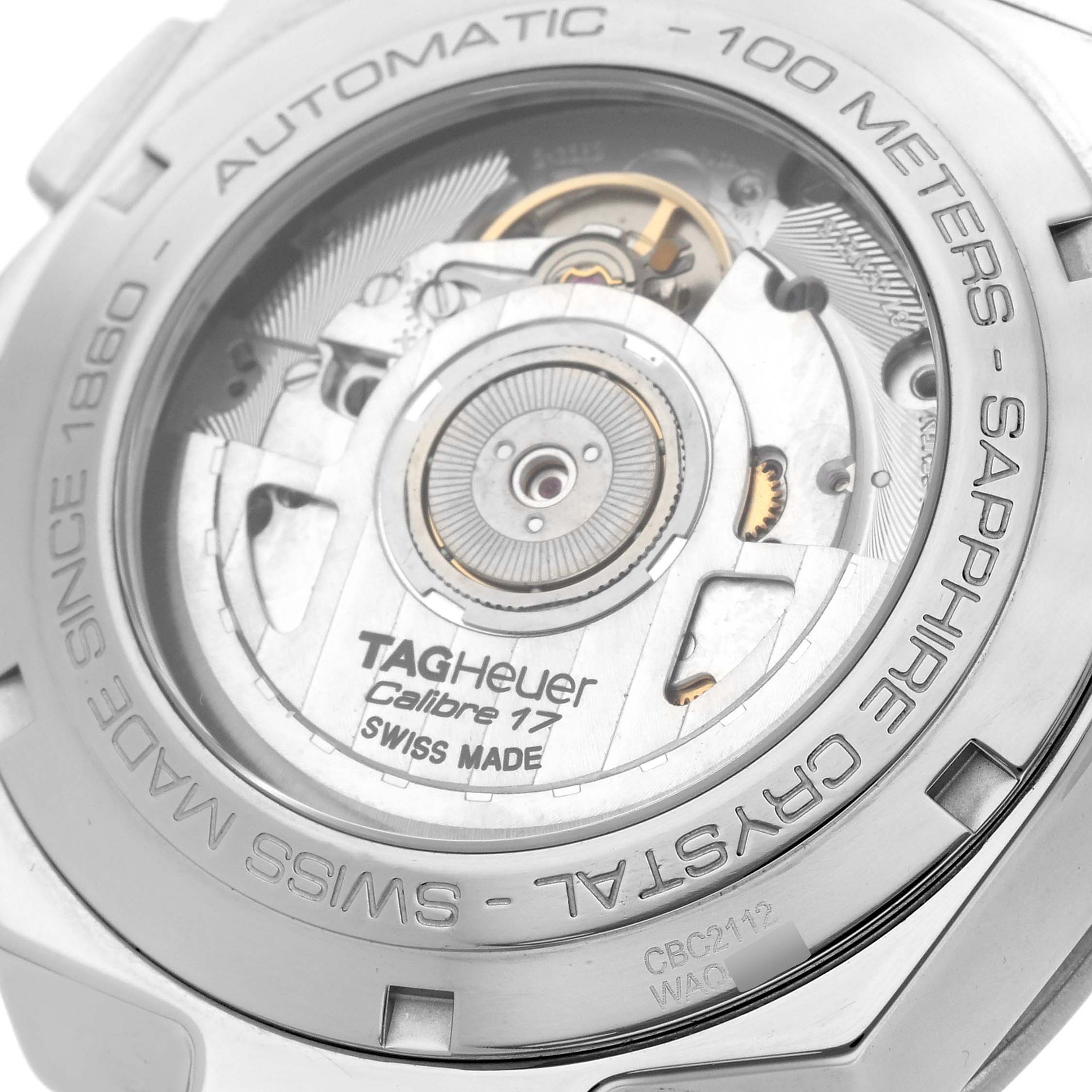 The image shows the back of a Tag Heuer Link CBC2112.BA0603 Men's Stainless Steel Blue Dial CBC2112.BA0603 Men's Stainless Steel Blue Dial model watch, highlighting its automatic movement and Calibre 17 mechanism.