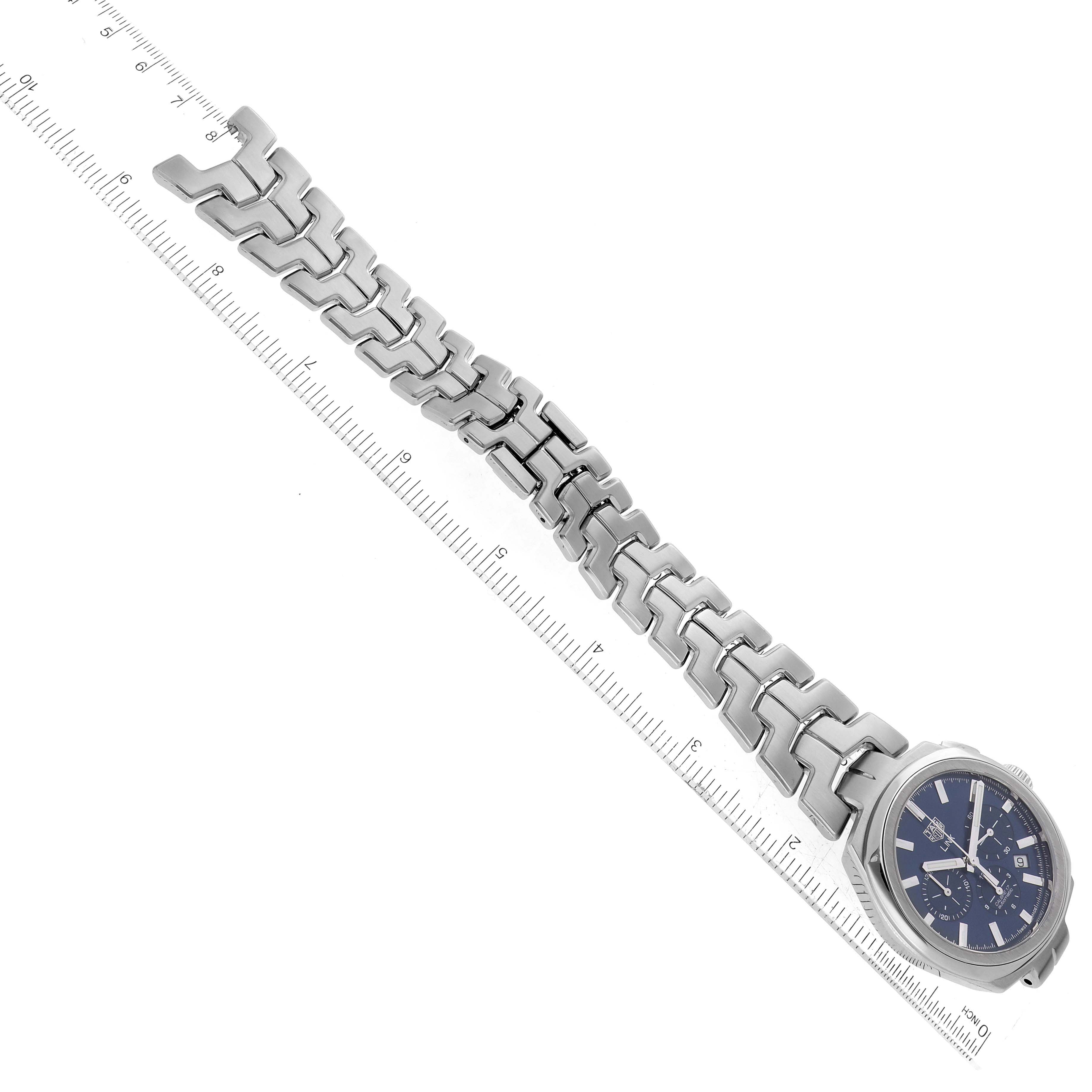 The image shows a Link model watch by Tag Heuer from an angled top-down view, including the bracelet and watch face.