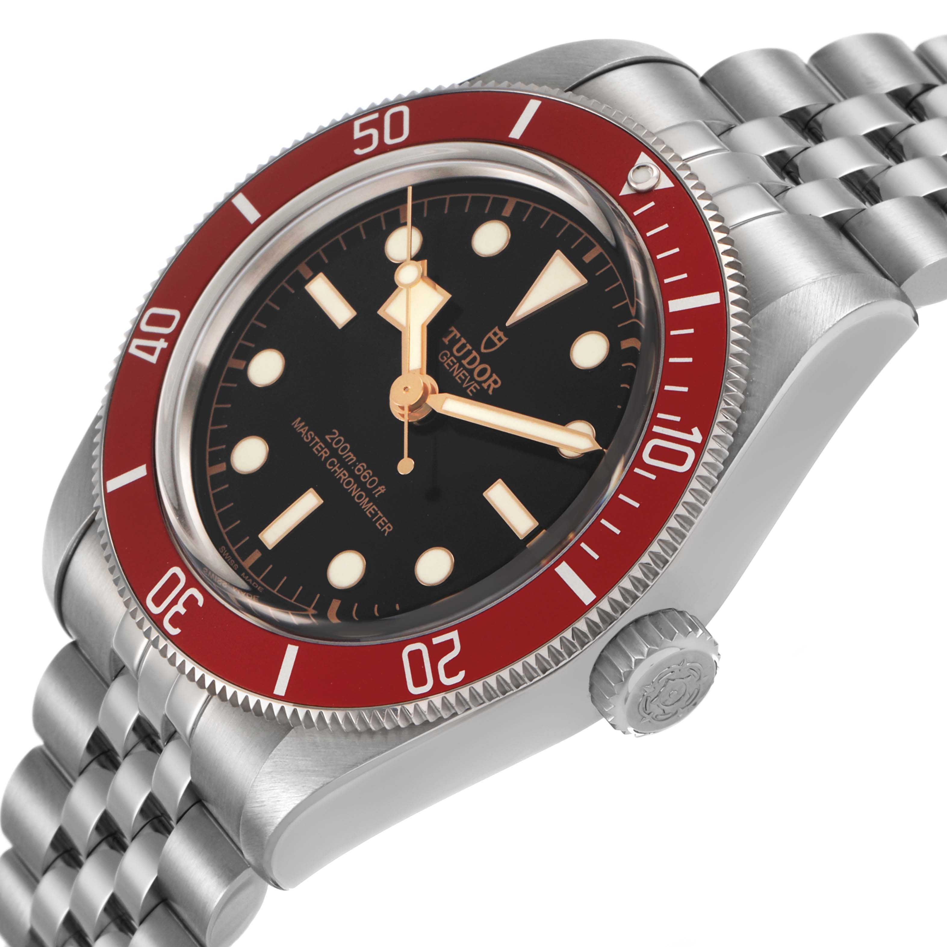 The Tudor Heritage Black Bay 7941A1A0 Men's Stainless Steel Black Dial watch is shown at a side angle, highlighting its bezel, crown, and bracelet.