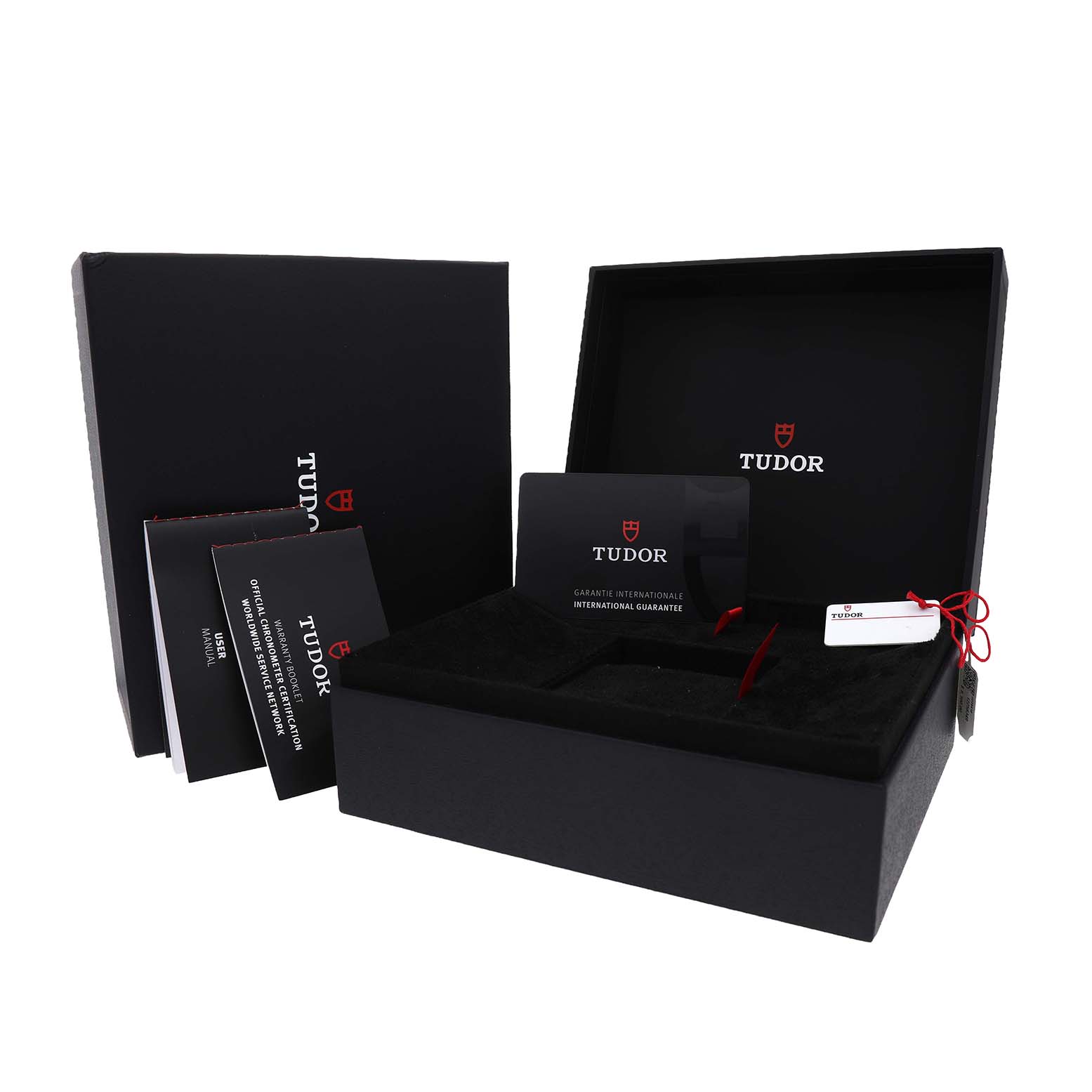 The image shows the Tudor Heritage Black Bay 7941A1A0 Men's Stainless Steel Black Dial packaging open, with booklets and a warranty card visible.