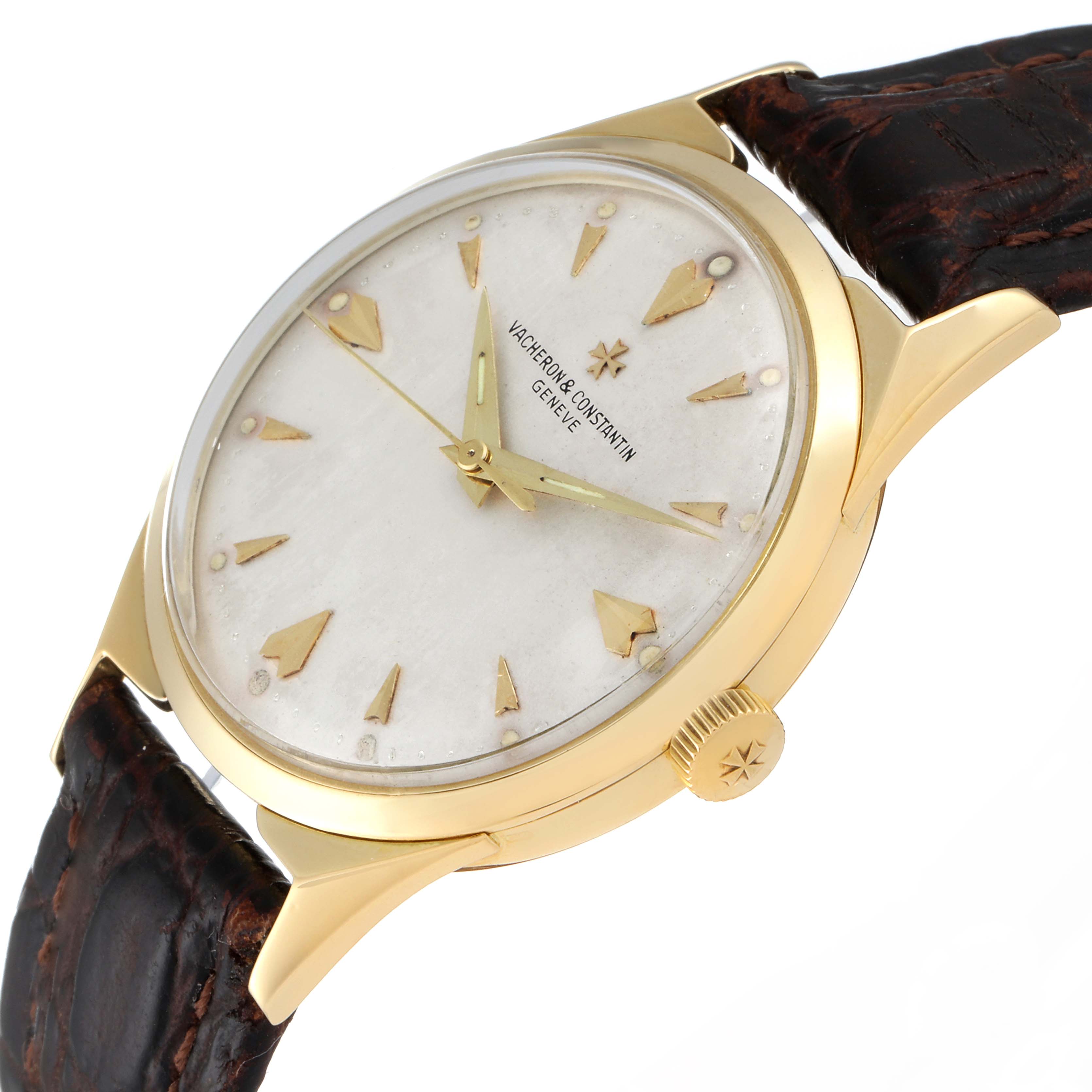 This Vacheron Constantin Vintage Men's Yellow Gold Silver Dial Men's Yellow Gold Silver Dial watch is shown at an angled view, highlighting the dial, crown, gold case, and leather strap.
