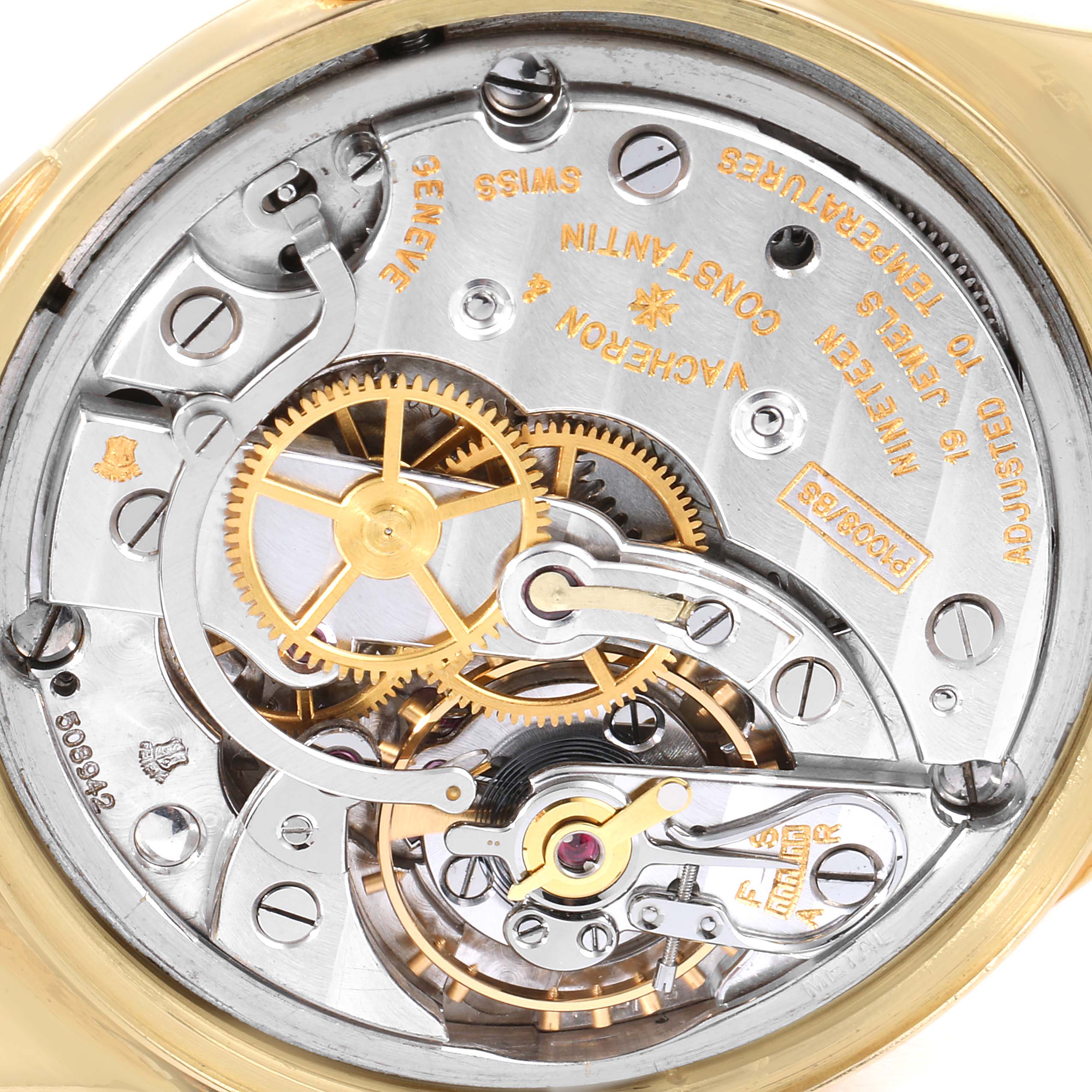 The image shows a close-up view of the intricate movement parts of a Vintage Vacheron Constantin watch.