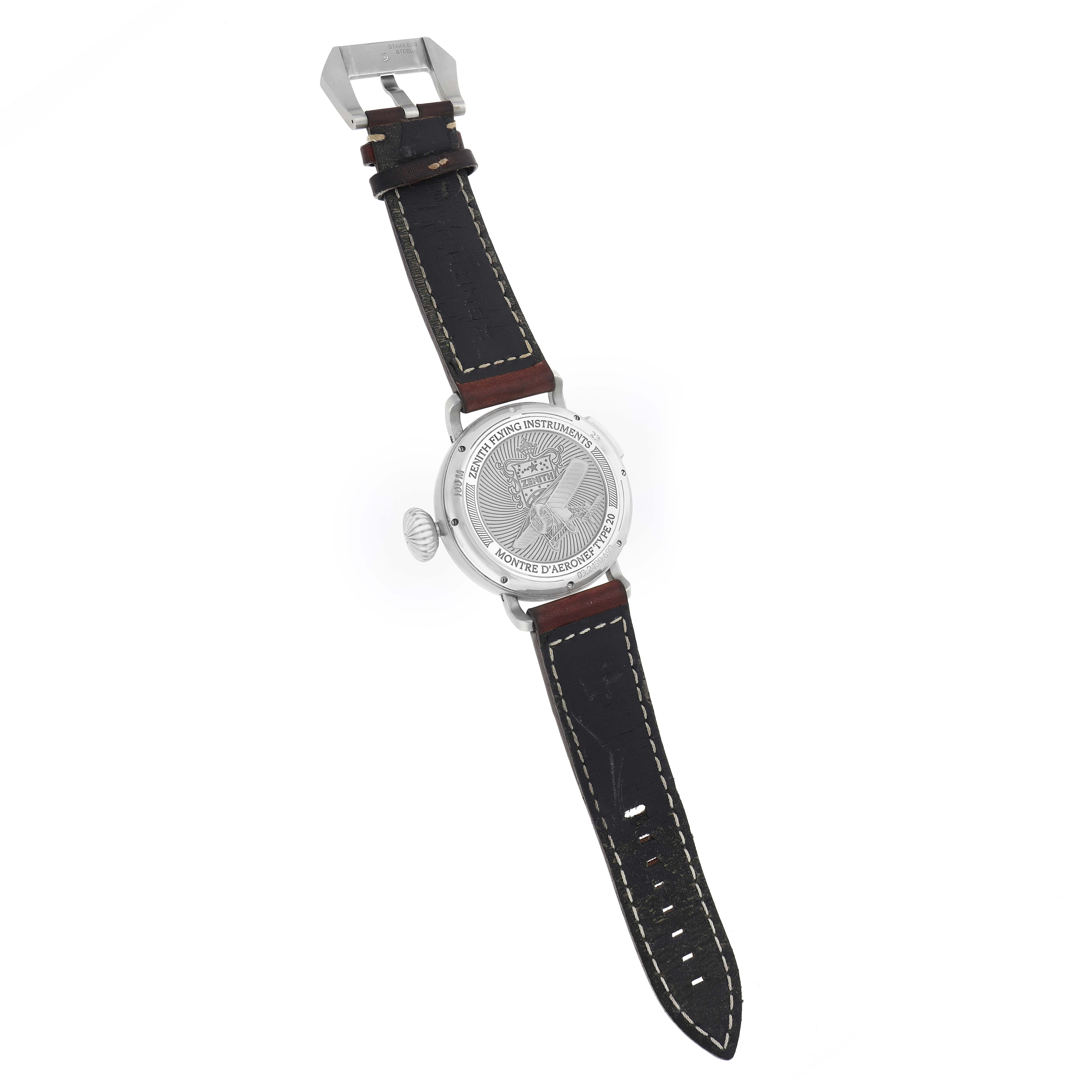 The image shows the back of a Zenith Pilot 03.2430.693 Men
s Stainless Steel Black Dial watch with a focus on the case back, strap, and buckle.