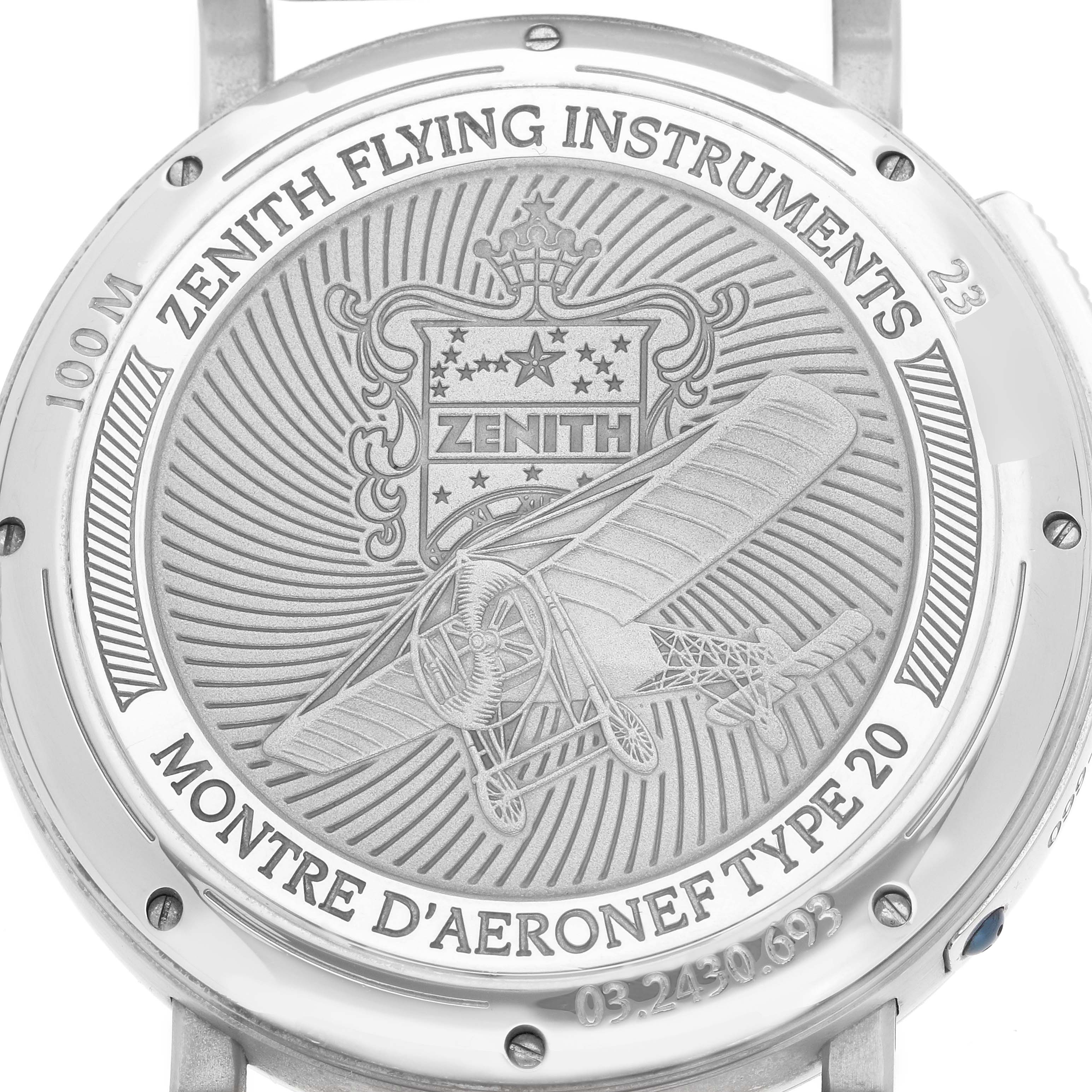 The image shows the back of the Zenith Pilot 03.2430.693 Men
s Stainless Steel Black Dial watch, featuring an engraved design with an aircraft and brand details.