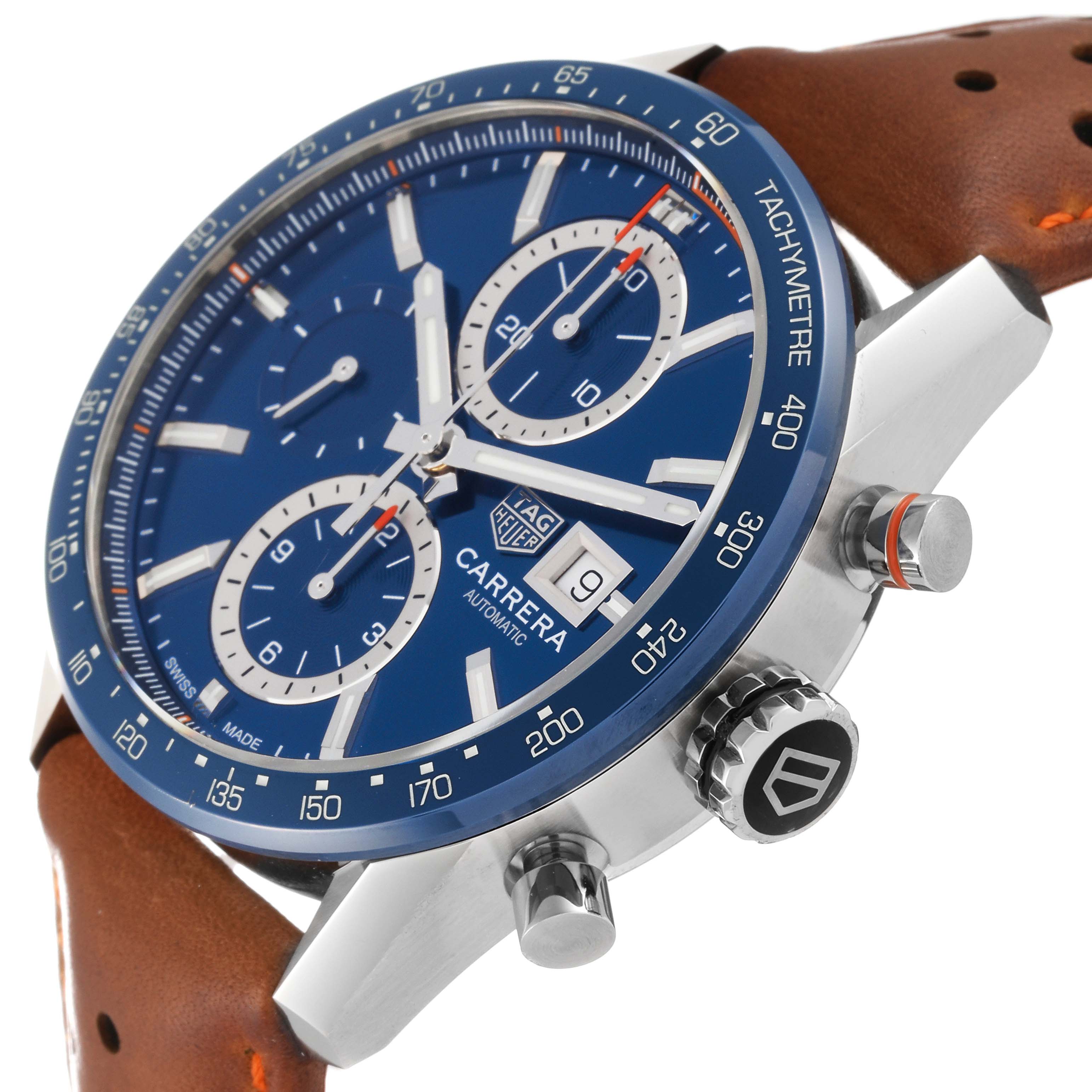 The image shows a side view of the Tag Heuer Carrera CBM2112 Men's Stainless Steel Blue Dial CBM2112 Men's Stainless Steel Blue Dial watch, highlighting the face, crown, chronograph pushers, and brown leather strap.