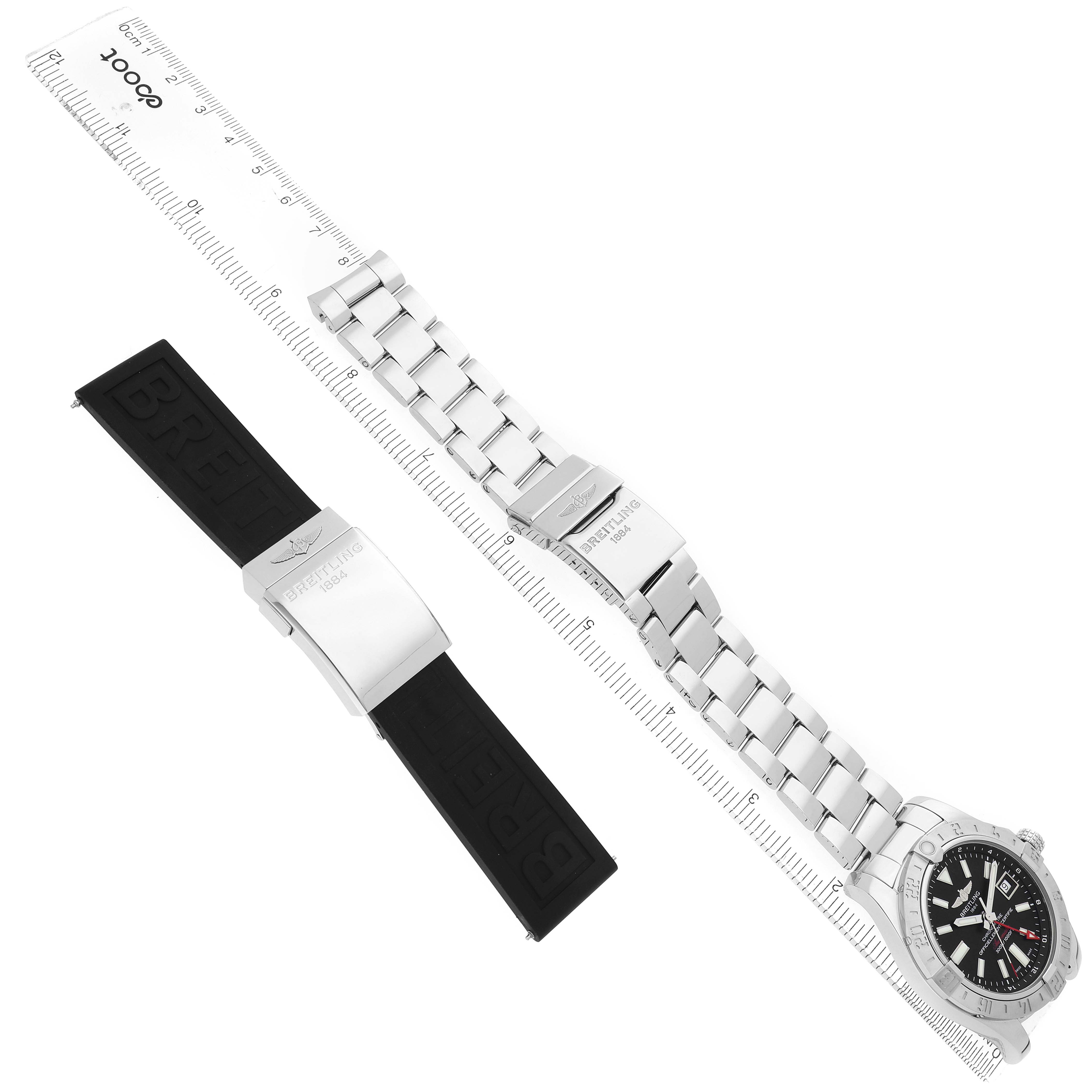 The Breitling Avenger A3239011/BC35 Men
s Stainless Steel Black Dial watch is shown at an angled top view with a stainless steel bracelet and an additional rubber strap next to it.