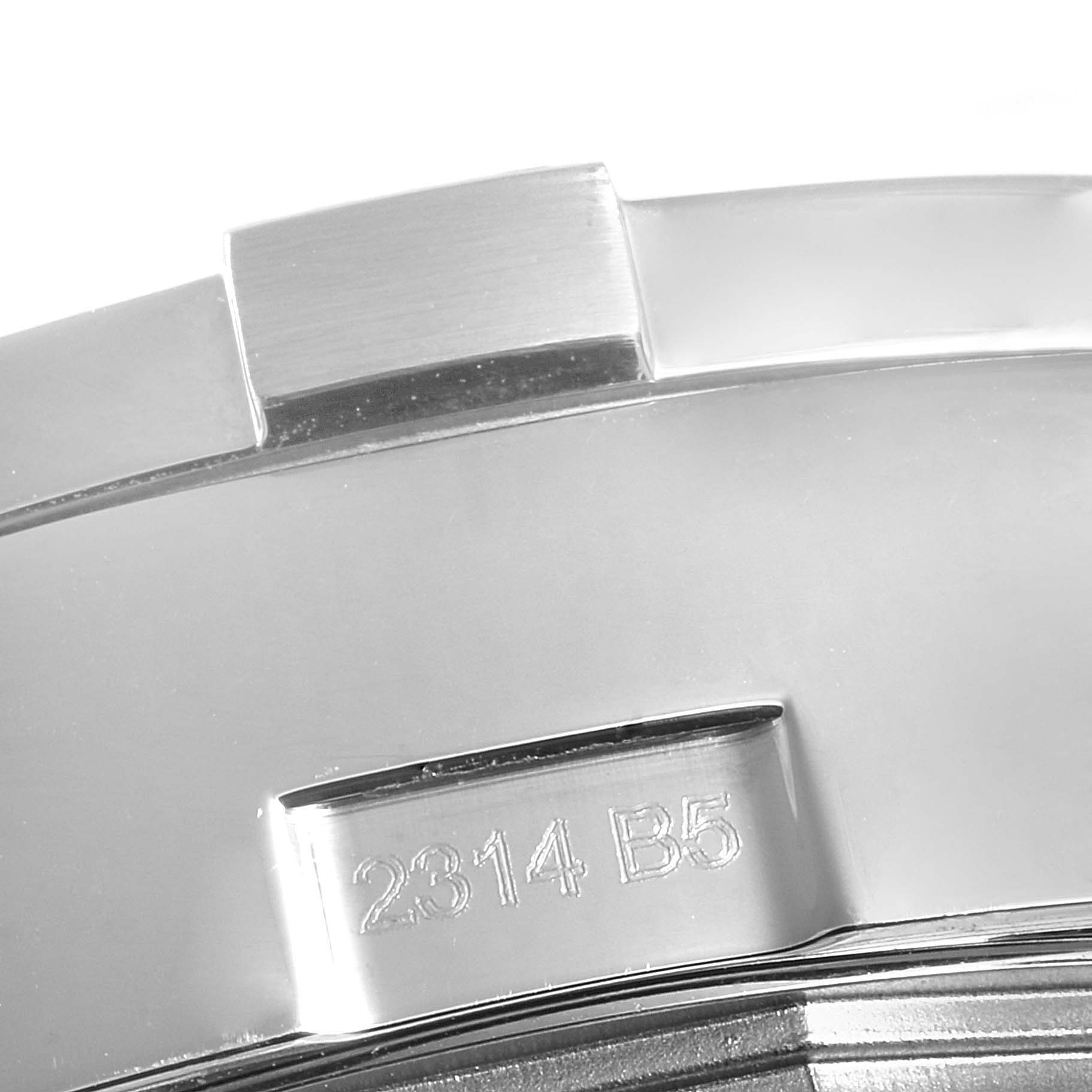 The image shows a close-up of the bezel and case of a Breitling Avenger A13381 Men's Stainless Steel White Dial A13381 Men's Stainless Steel White Dial watch with part of its serial number visible.