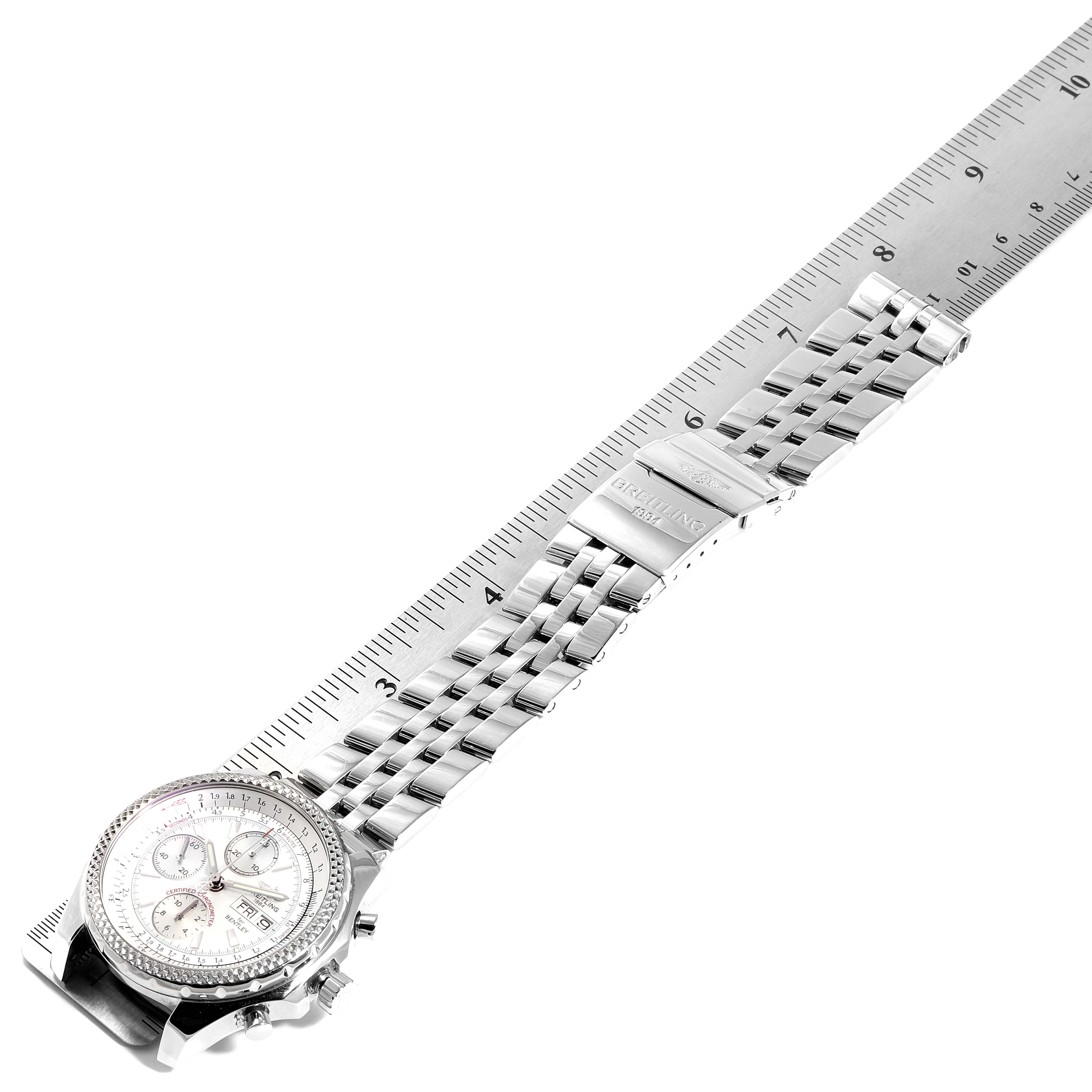 The image shows a side view of the Breitling Bentley A13362 Men's Stainless Steel Silver Dial A13362 Men's Stainless Steel Silver Dial model watch with its face and metal bracelet measured against a ruler.