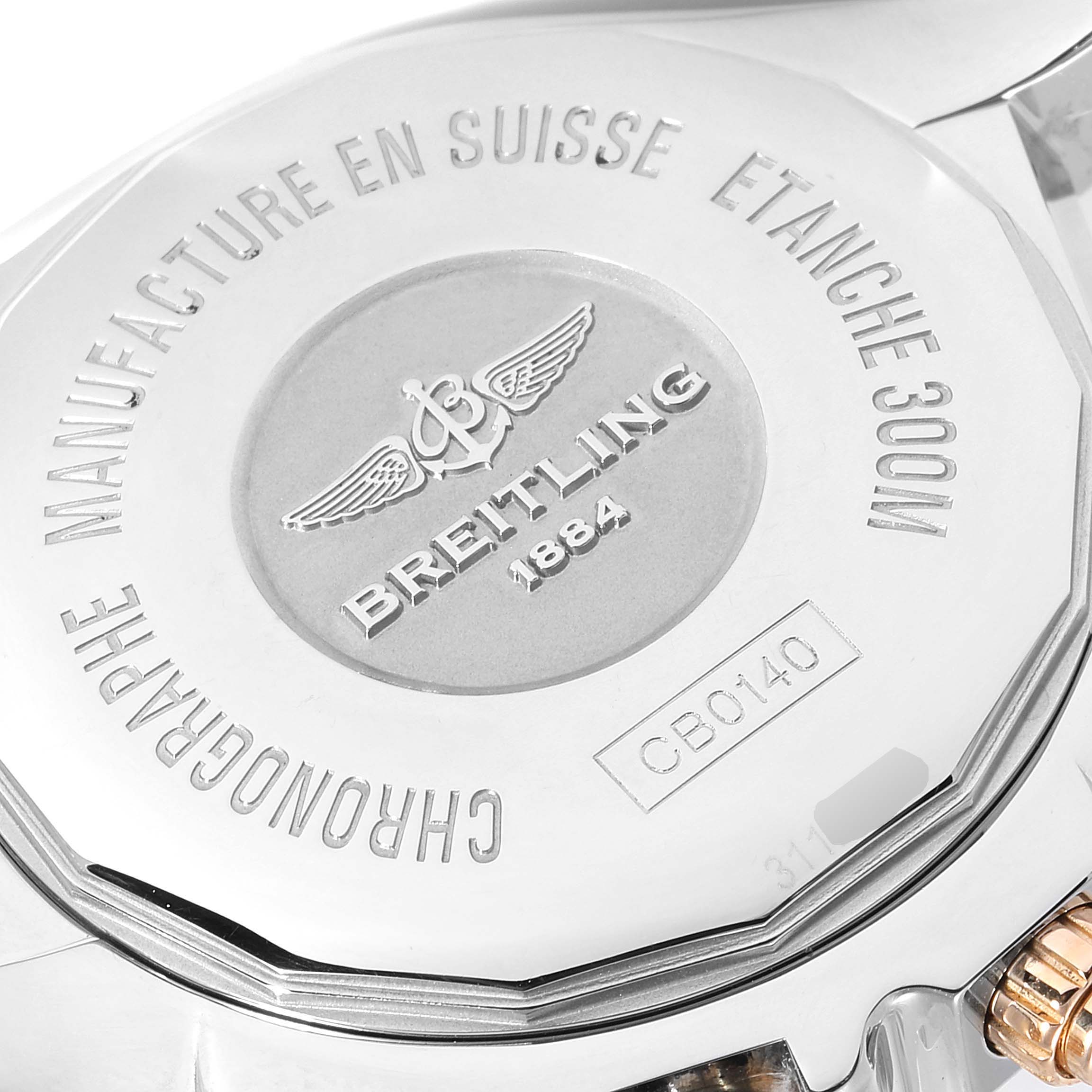 This image shows the case back of a Breitling Chronomat CB0140Y2/A743-378C Men's Steel and Gold (two tone) Silver Dial CB0140Y2/A743-378C Men's Steel and Gold (two tone) Silver Dial watch, highlighting engravings and inscriptions about its manufacture and water resistance.