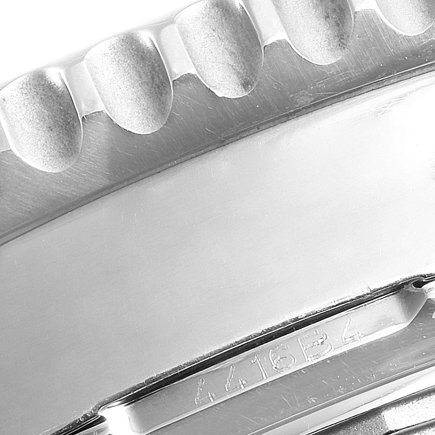 This image shows a close-up of the bezel and casing edge of a Breitling Navitimer AB044121/BD24/443A Men
s Stainless Steel Black Dial AB044121/BD24/443A Men
s Stainless Steel Black Dial watch.