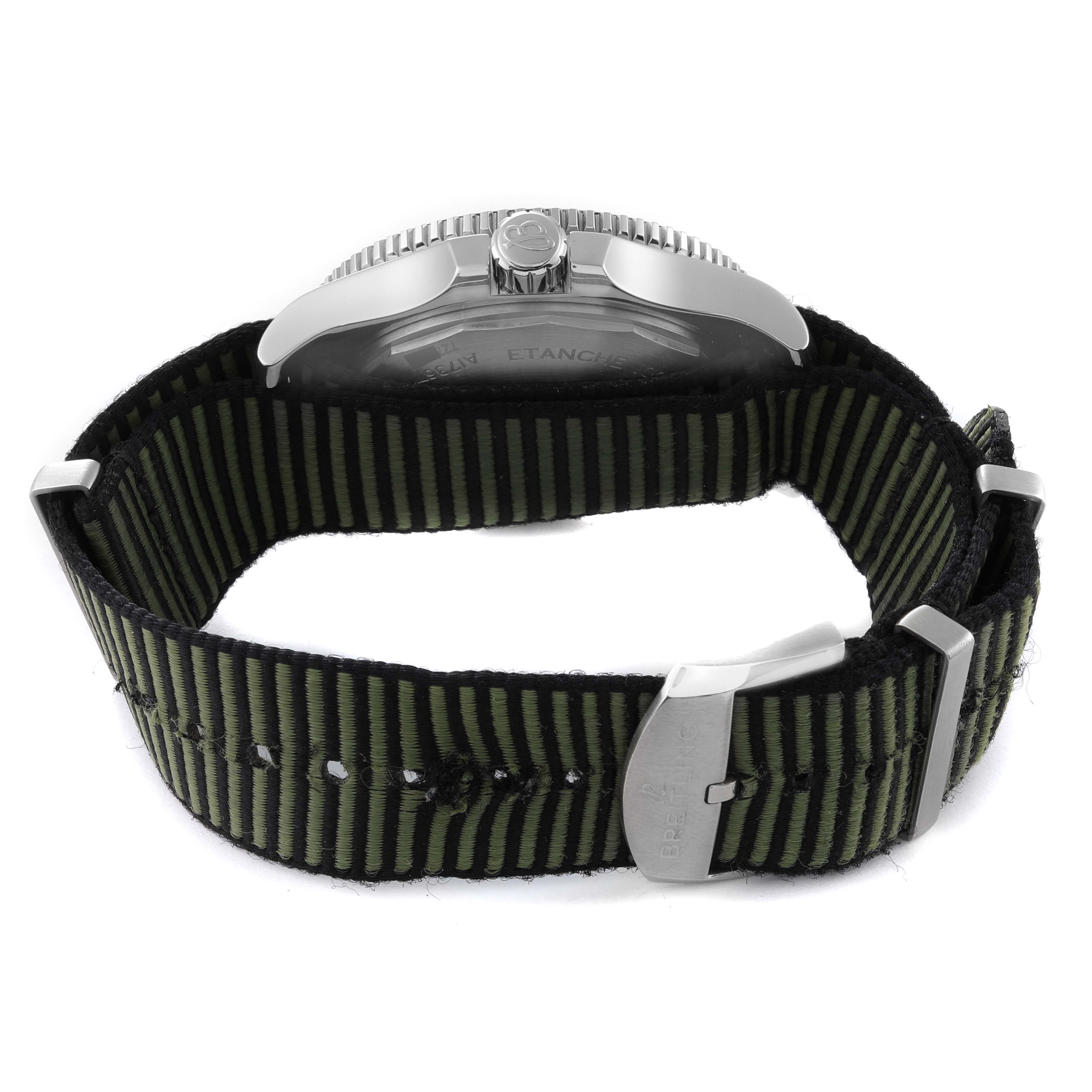 The image shows the back and side view of a Breitling Superocean A17367 Men's Stainless Steel Green Dial A17367 Men's Stainless Steel Green Dial watch, with a focus on its green and black striped strap and buckle.