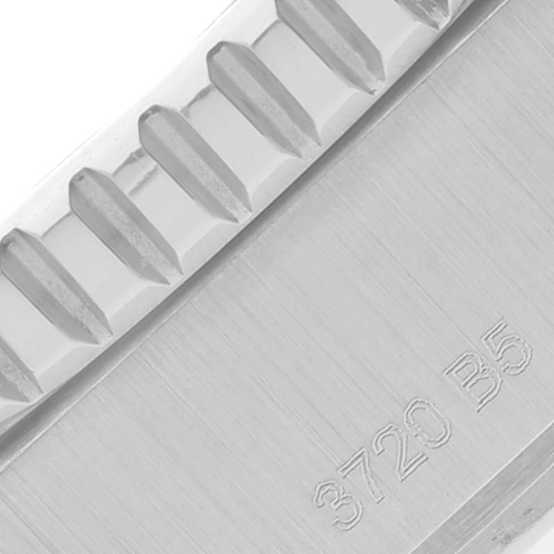 This close-up shows the side view of the bezel and case of the Breitling Superocean A17367 Men's Stainless Steel Green Dial A17367 Men's Stainless Steel Green Dial watch, featuring detailed engravings.