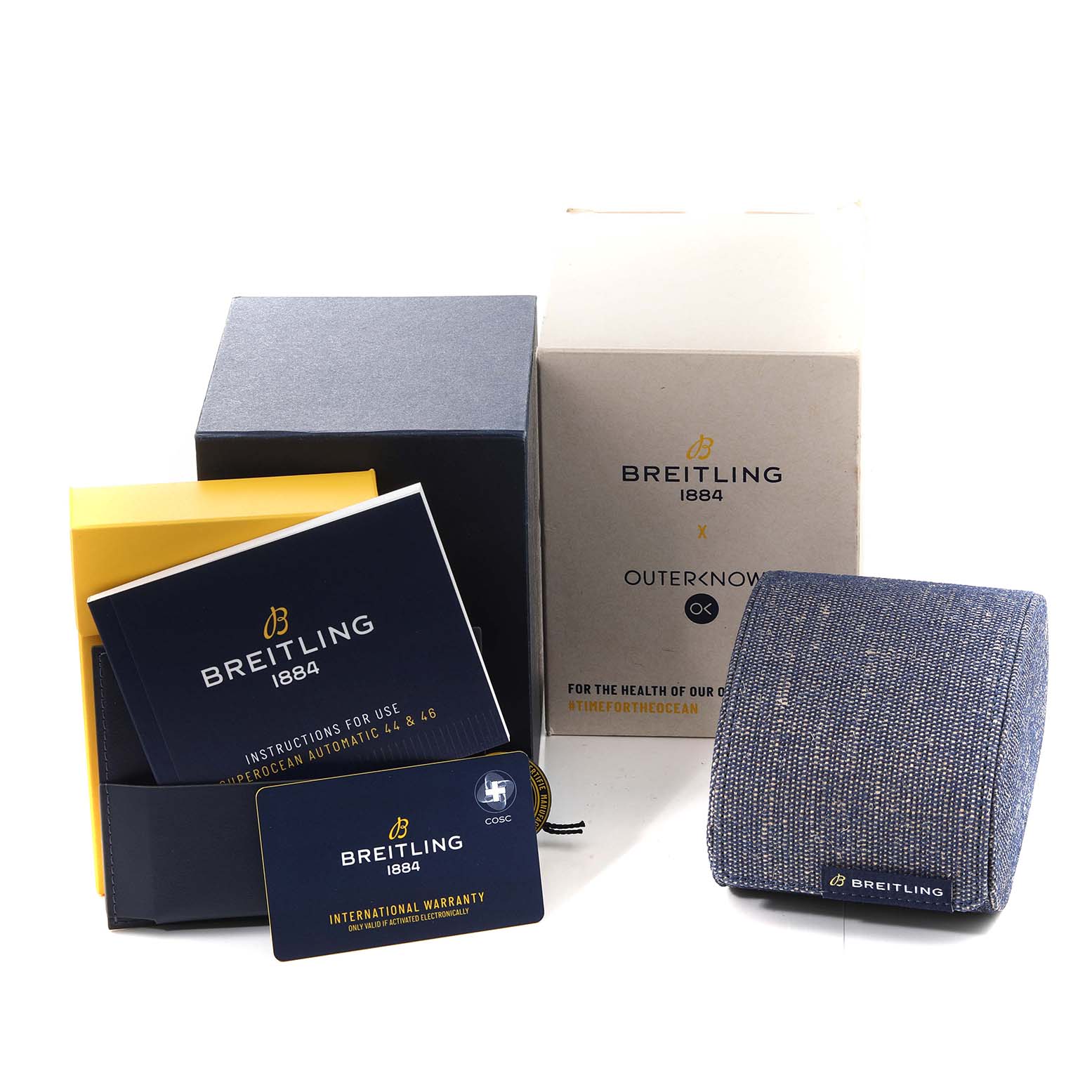 This image shows the packaging, booklet, warranty card, and a fabric pouch for a Breitling Superocean A17367 Men's Stainless Steel Green Dial A17367 Men's Stainless Steel Green Dial watch.