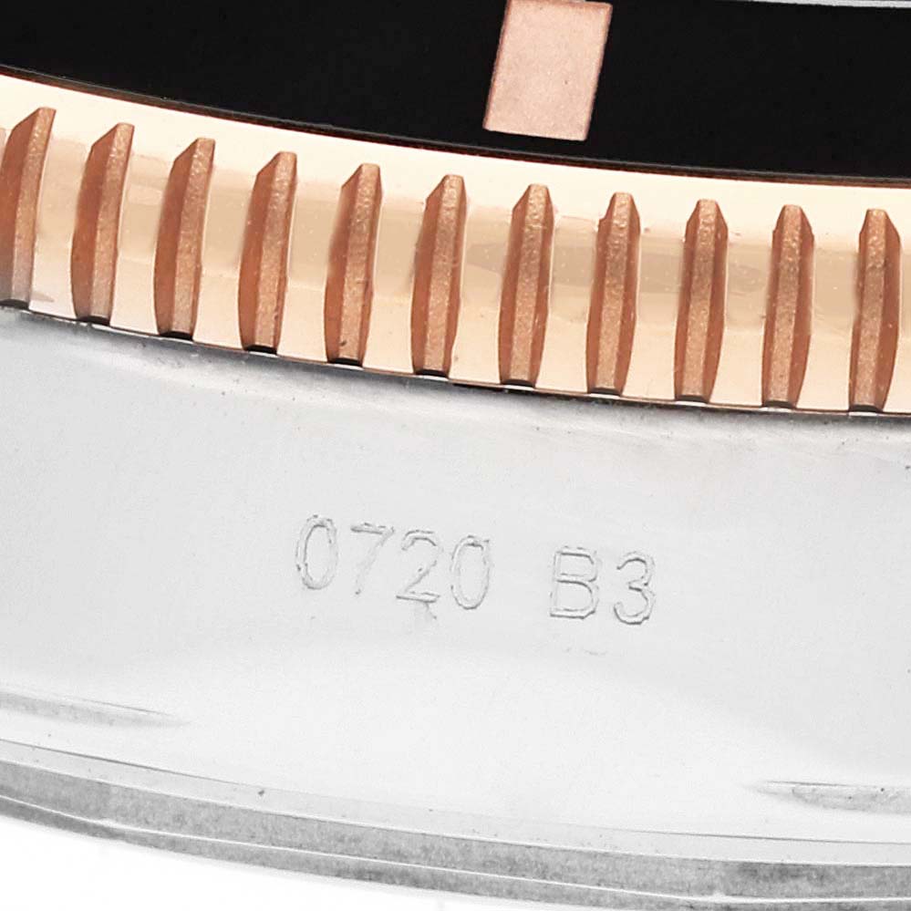 This image shows a close-up of the bezel and case side of the Breitling Superocean UB2010 Men's Steel and Gold (two tone) Black Dial UB2010 Men's Steel and Gold (two tone) Black Dial watch.