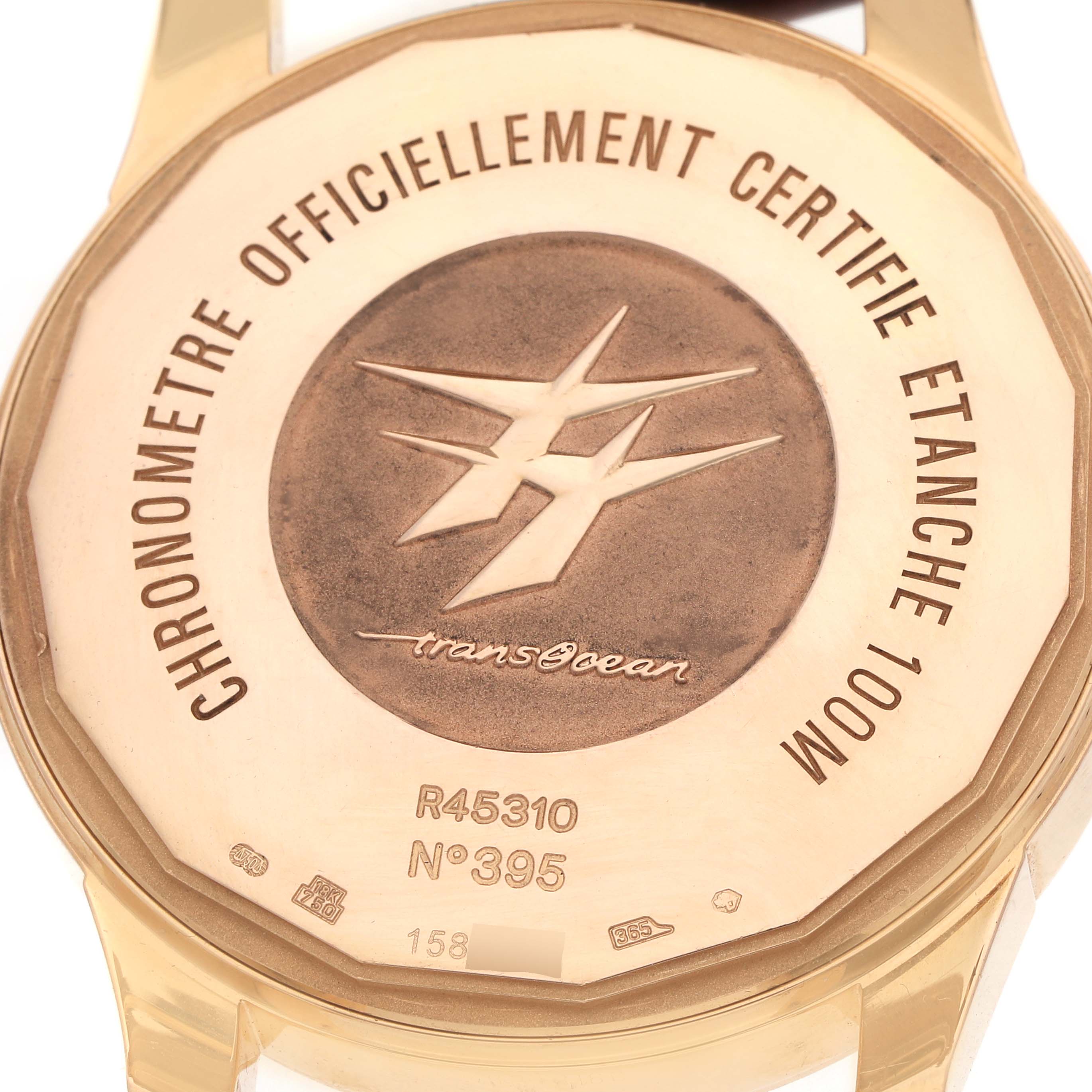 The image shows the back case of the Breitling Transocean R45310 Men
s Rose Gold Silver Dial watch from a top-down angle.