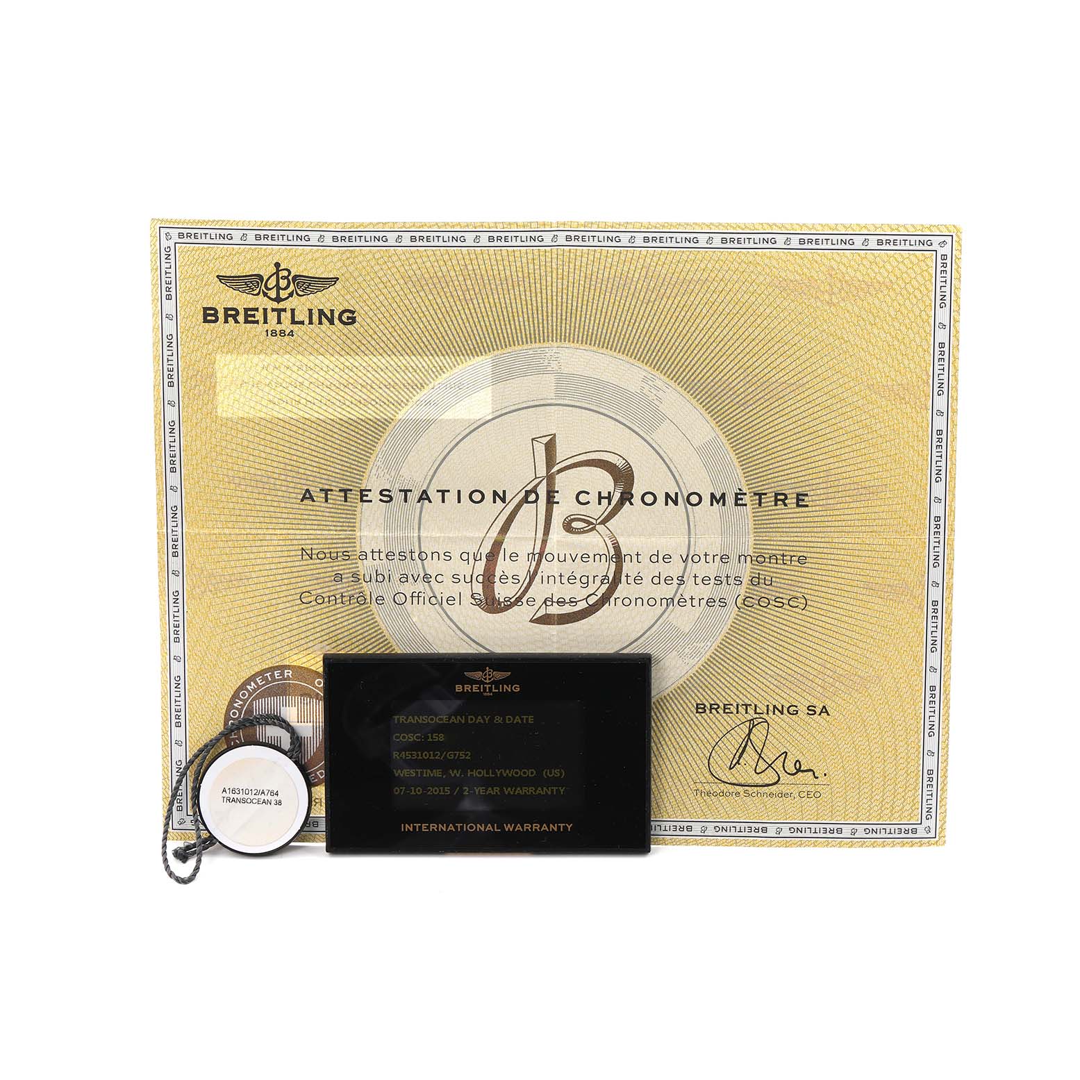 The image shows the Breitling Transocean R45310 Men
s Rose Gold Silver Dial model
s certificate, international warranty card, and a tag with model details.