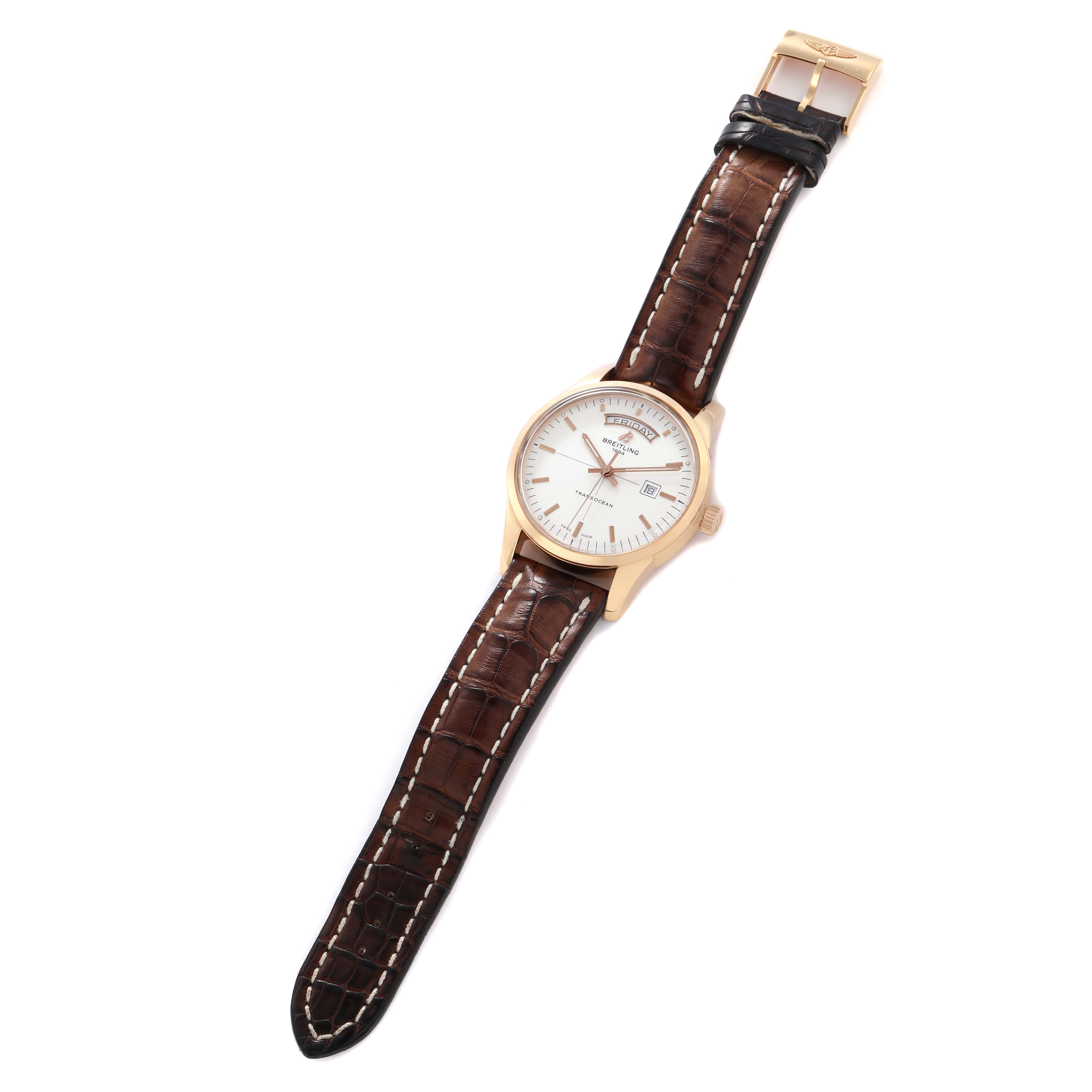 The Breitling Transocean R45310 Men
s Rose Gold Silver Dial watch is shown top-down, displaying the face, case, crown, and entire leather strap.
