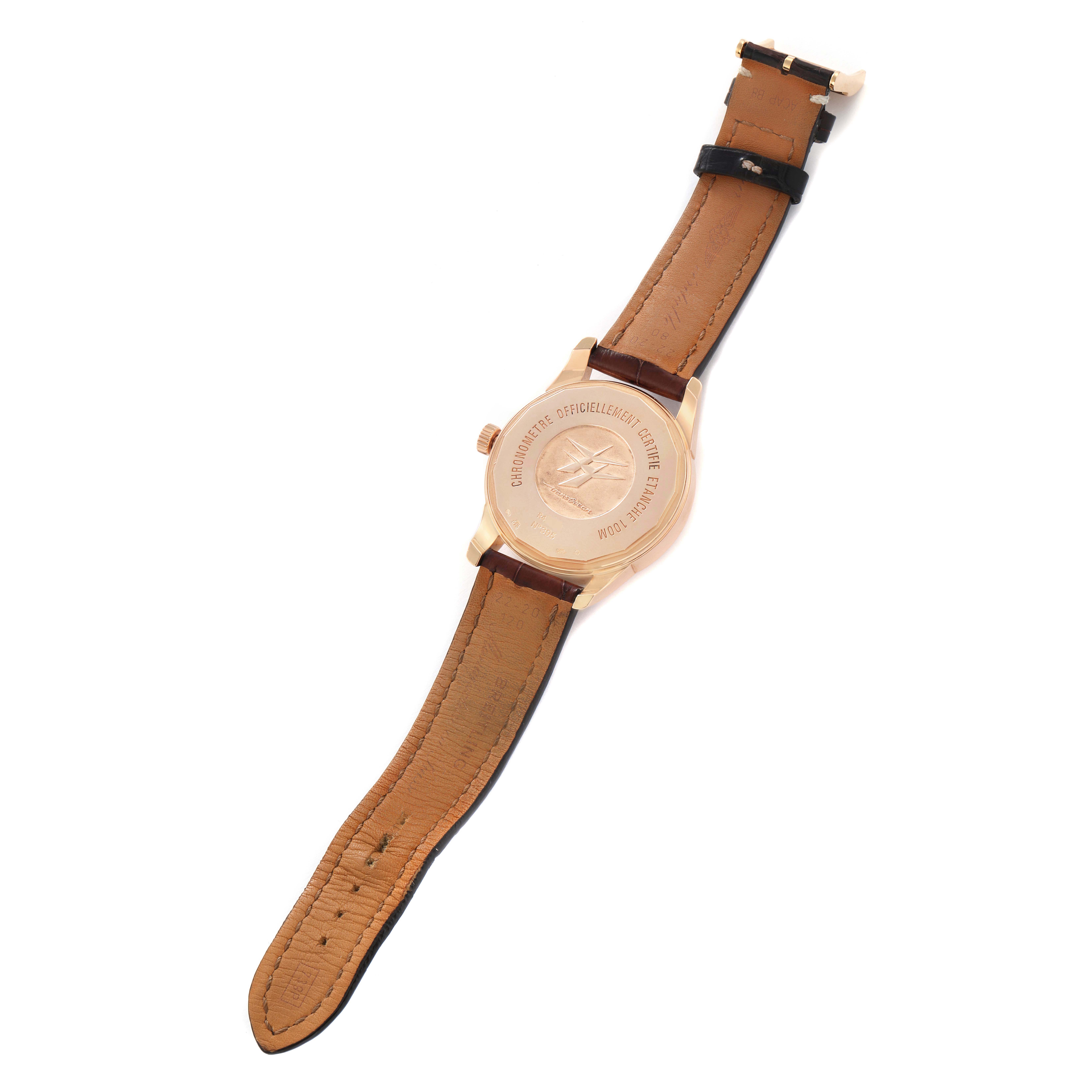 The image shows the back of a Breitling Transocean R45310 Men's Rose Gold Silver Dial watch, highlighting the case back and leather strap.