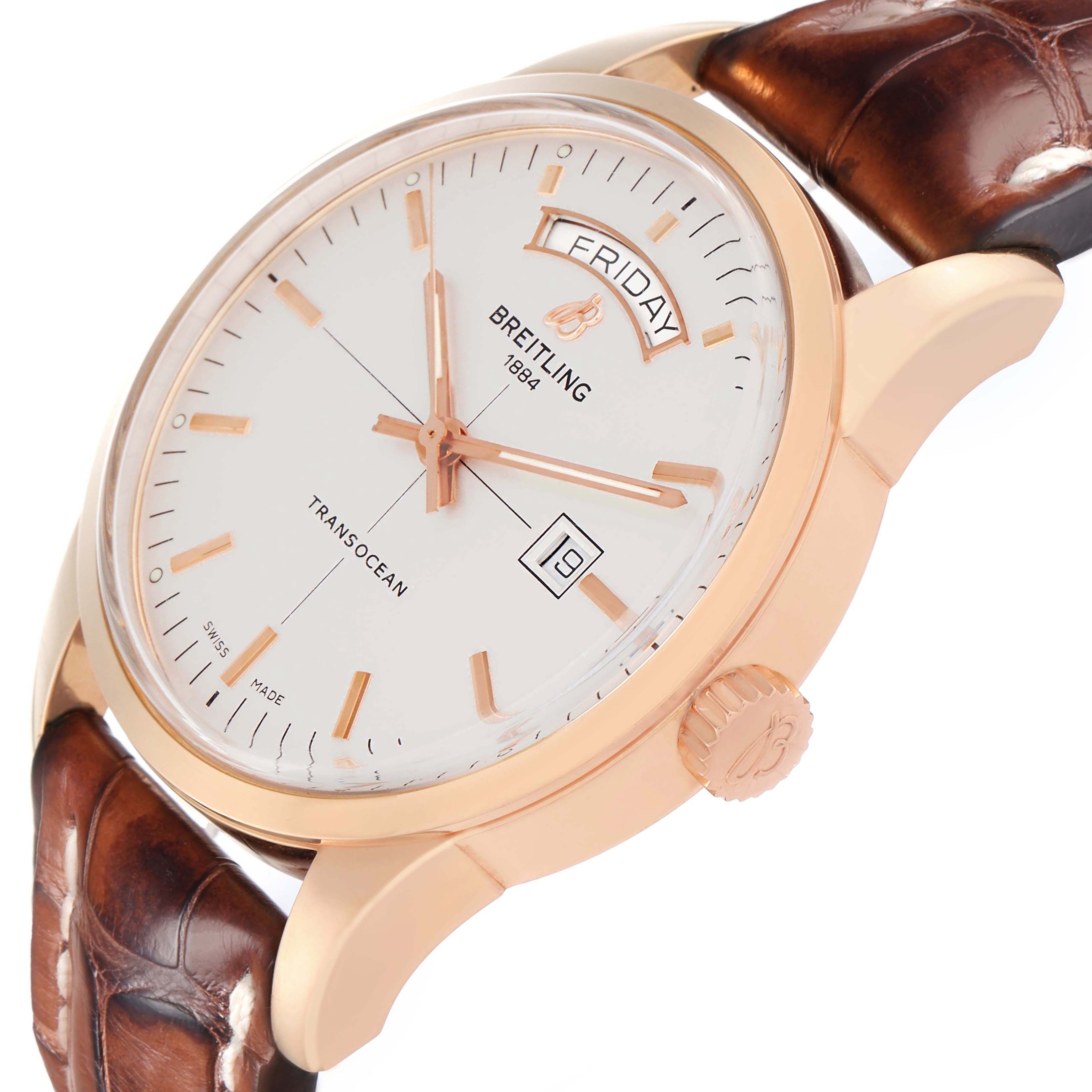 The Breitling Transocean R45310 Men's Rose Gold Silver Dial watch is shown at an angled side view, highlighting the dial, crown, and leather strap.