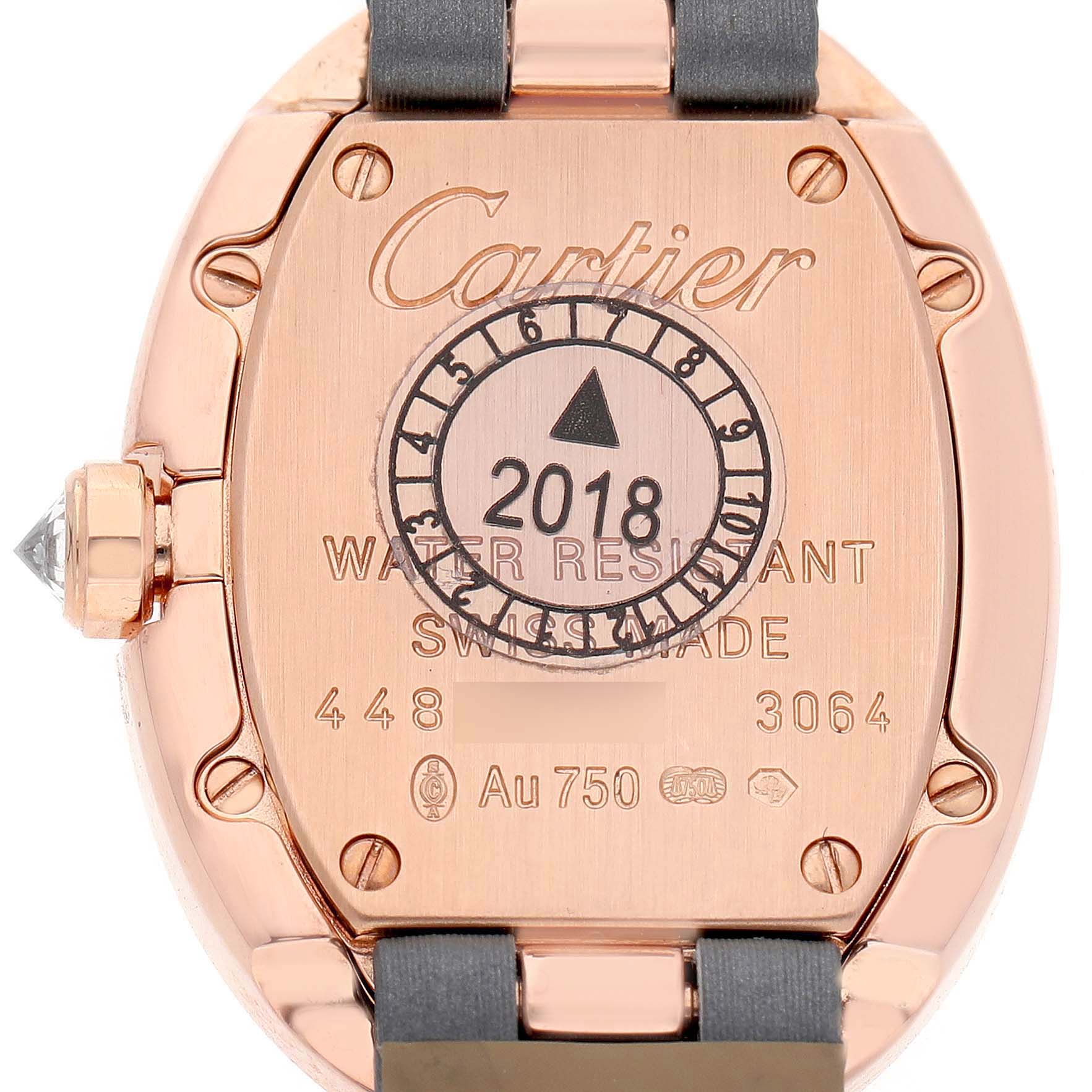 The image shows the back of a Cartier Baignoire WB520004 Women's Rose Gold Silver Dial watch, highlighting the case back details and markings.