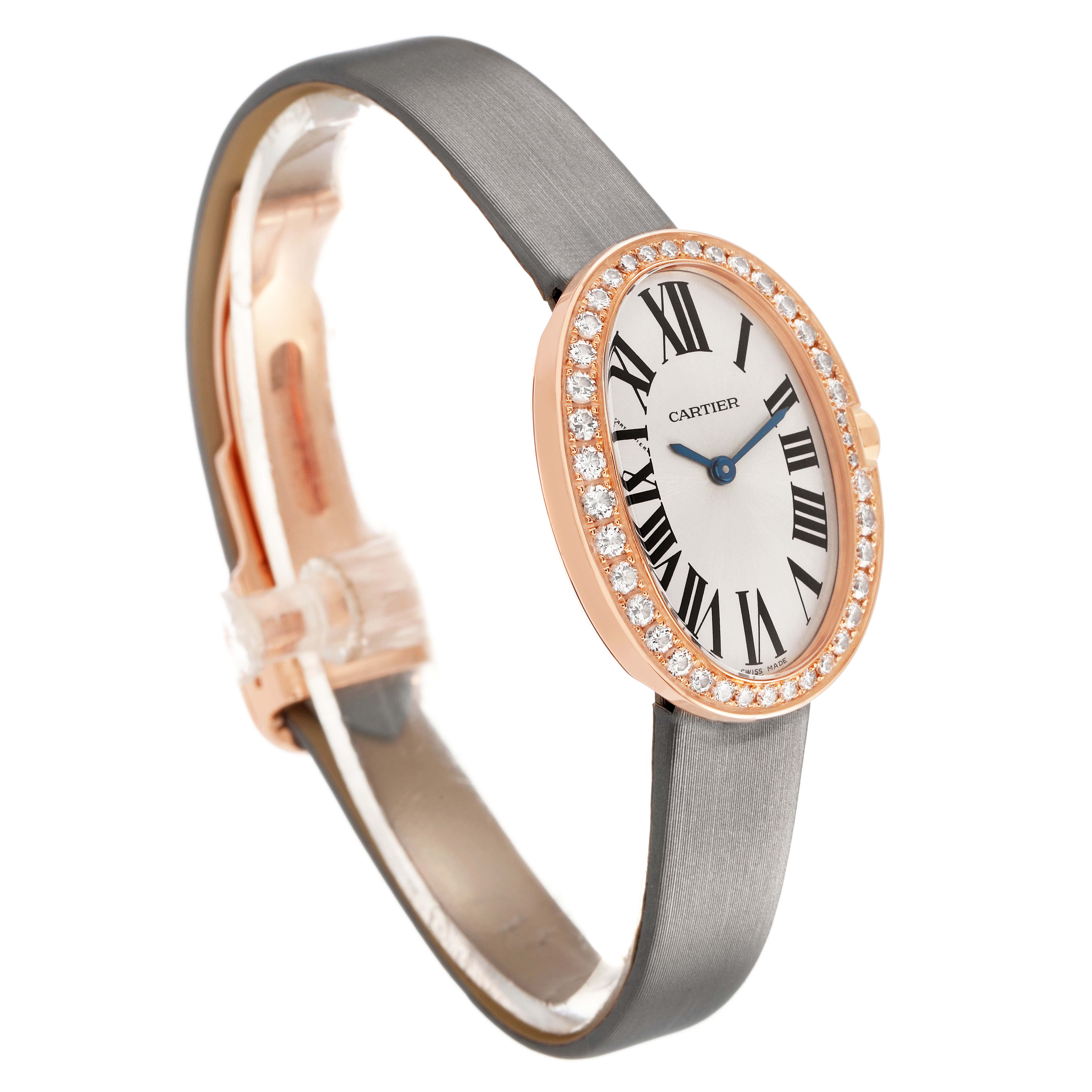 The Cartier Baignoire WB520004 Women's Rose Gold Silver Dial watch is shown at a three-quarter angle, highlighting its oval face, diamond bezel, and leather strap.