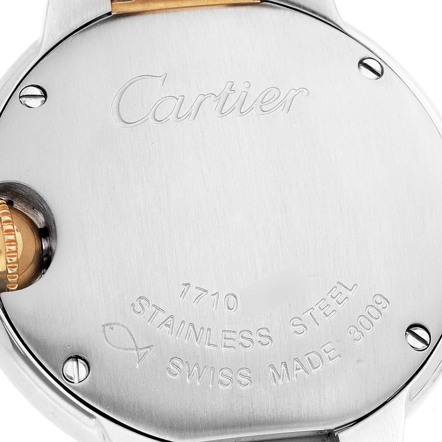 This image shows the back case of a Ballon Bleu by Cartier, including its engravings and crown.