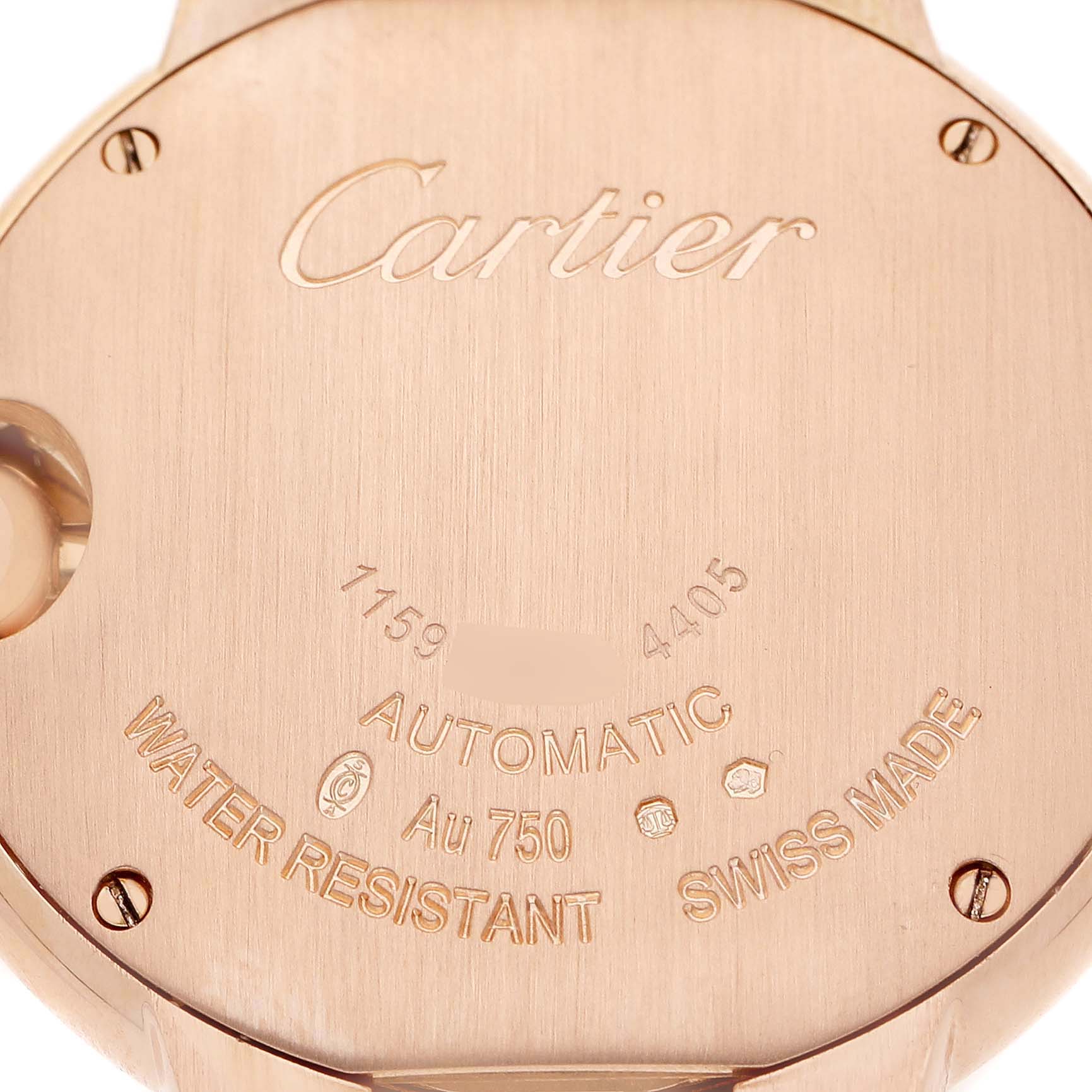 The image shows the back case of a Cartier Ballon Bleu WJBB0077 Women's Yellow Gold Pink Dial watch, displaying engravings and screws.