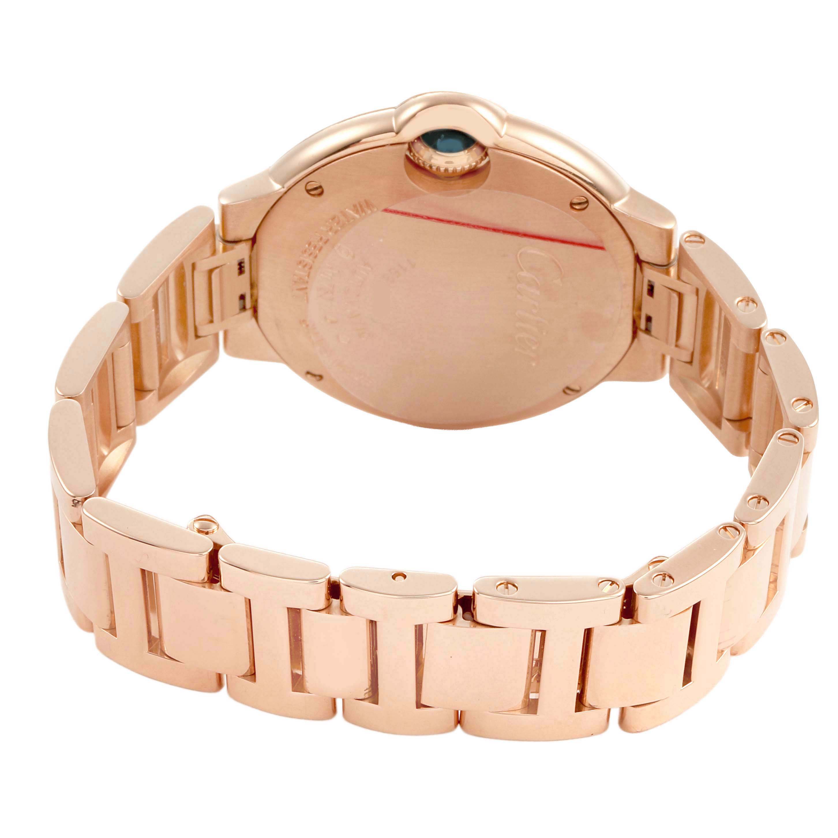 The image shows the back and bracelet of the Cartier Ballon Bleu WJBB0077 Women's Yellow Gold Pink Dial watch, highlighting the case back and link details.