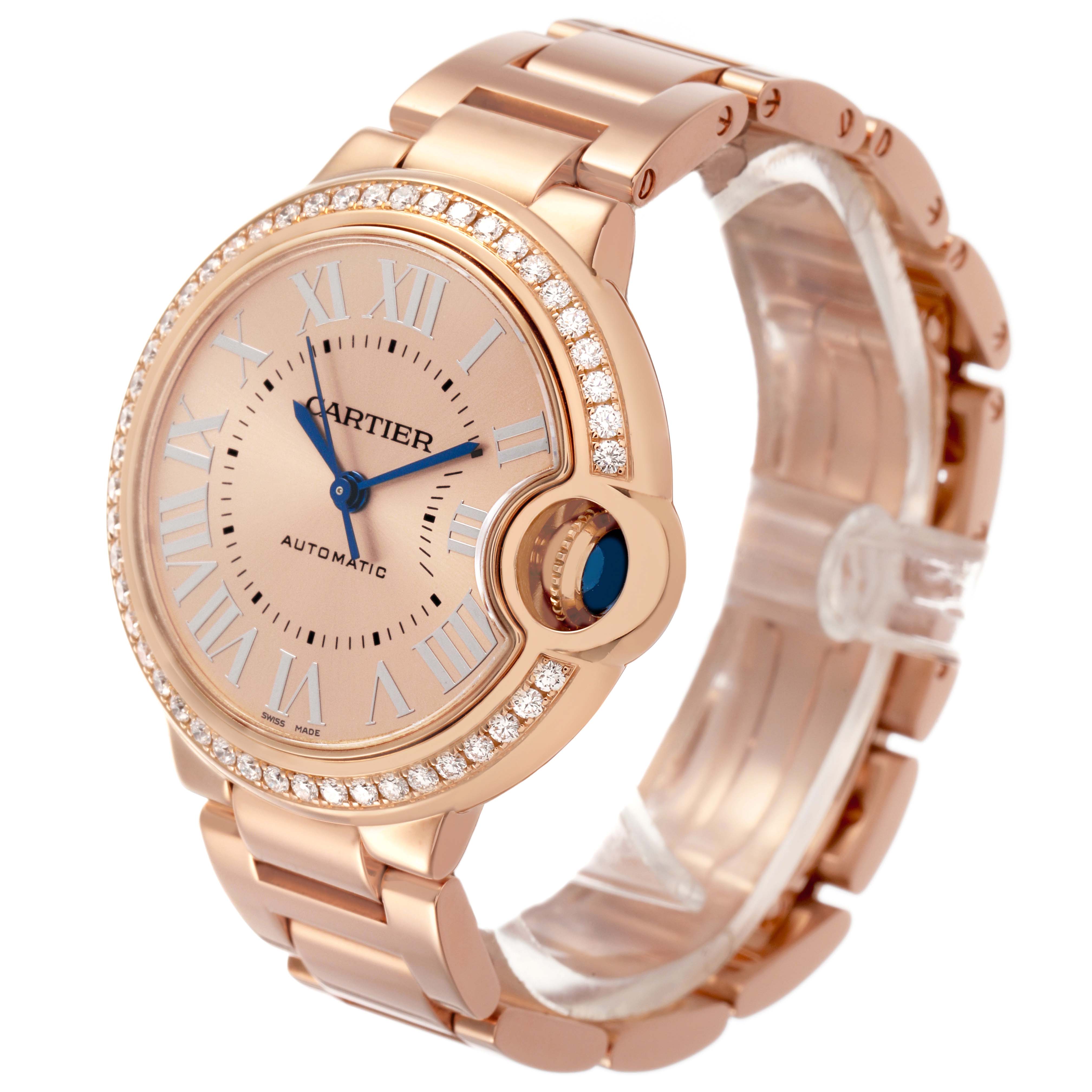 The Cartier Ballon Bleu WJBB0077 Women's Yellow Gold Pink Dial watch is shown at a three-quarter angle displaying the face, bezel, and part of the bracelet.