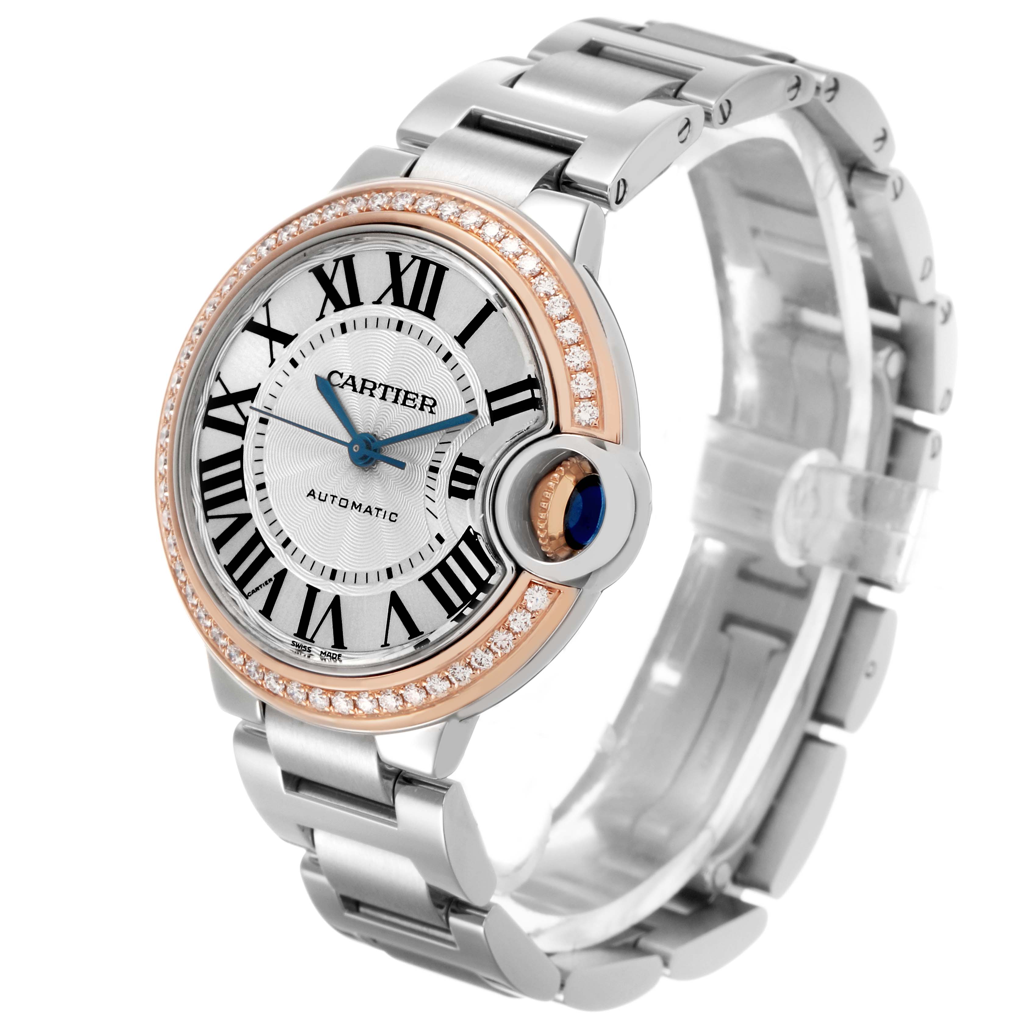 The Cartier Ballon Bleu WE902080 Women's Steel and Gold (two tone) Silver Dial watch is shown at an angle highlighting the face, bezel, and bracelet.