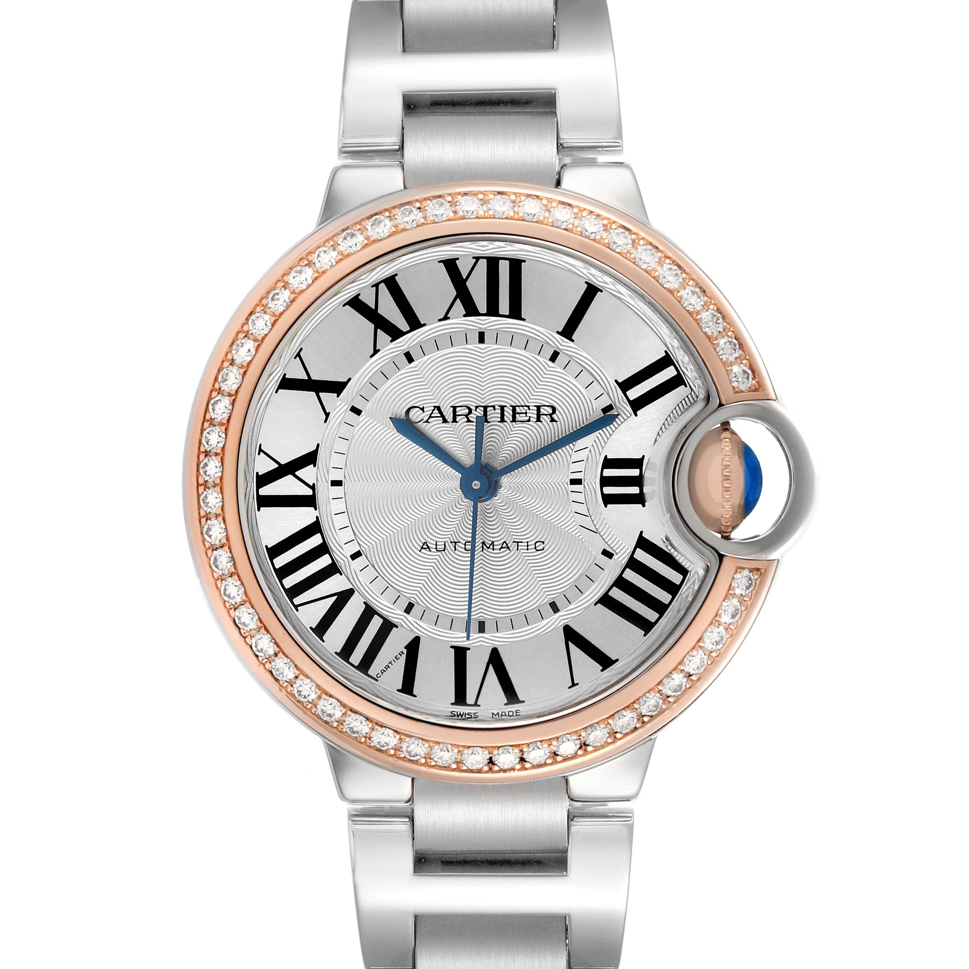 The Cartier Ballon Bleu WE902080 Women's Steel and Gold (two tone) Silver Dial watch is shown from the top, highlighting its round face, Roman numerals, diamond bezel, and crown.