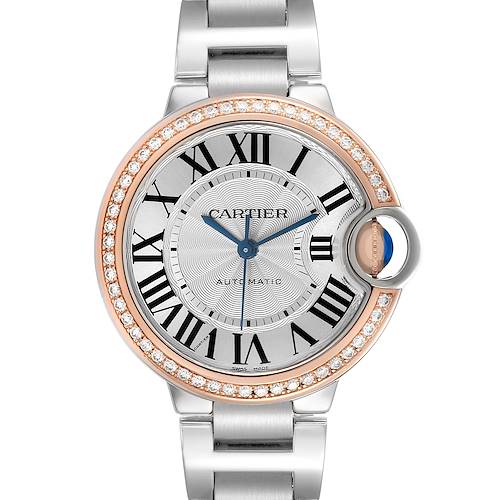 The Cartier Ballon Bleu WE902080 Women's Steel and Gold (two tone) Silver Dial watch is shown from a top-down angle, highlighting its gemstone-studded bezel and blue hands.