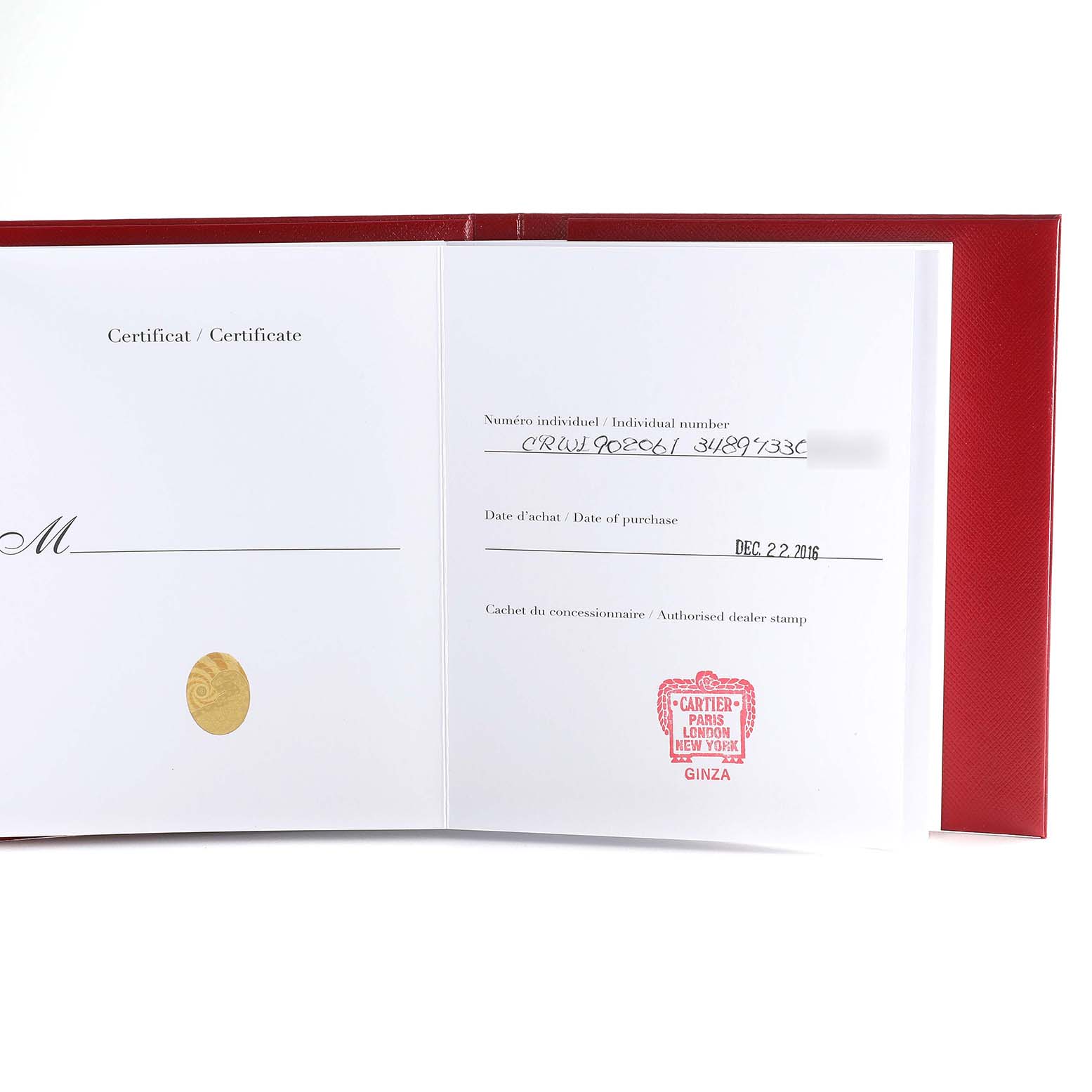 This image shows an open certificate booklet for a Cartier Ballon Bleu WE902061 Women
s Stainless Steel Silver Dial WE902061 Women
s Stainless Steel Silver Dial watch, displaying the dealer stamp and purchase details.