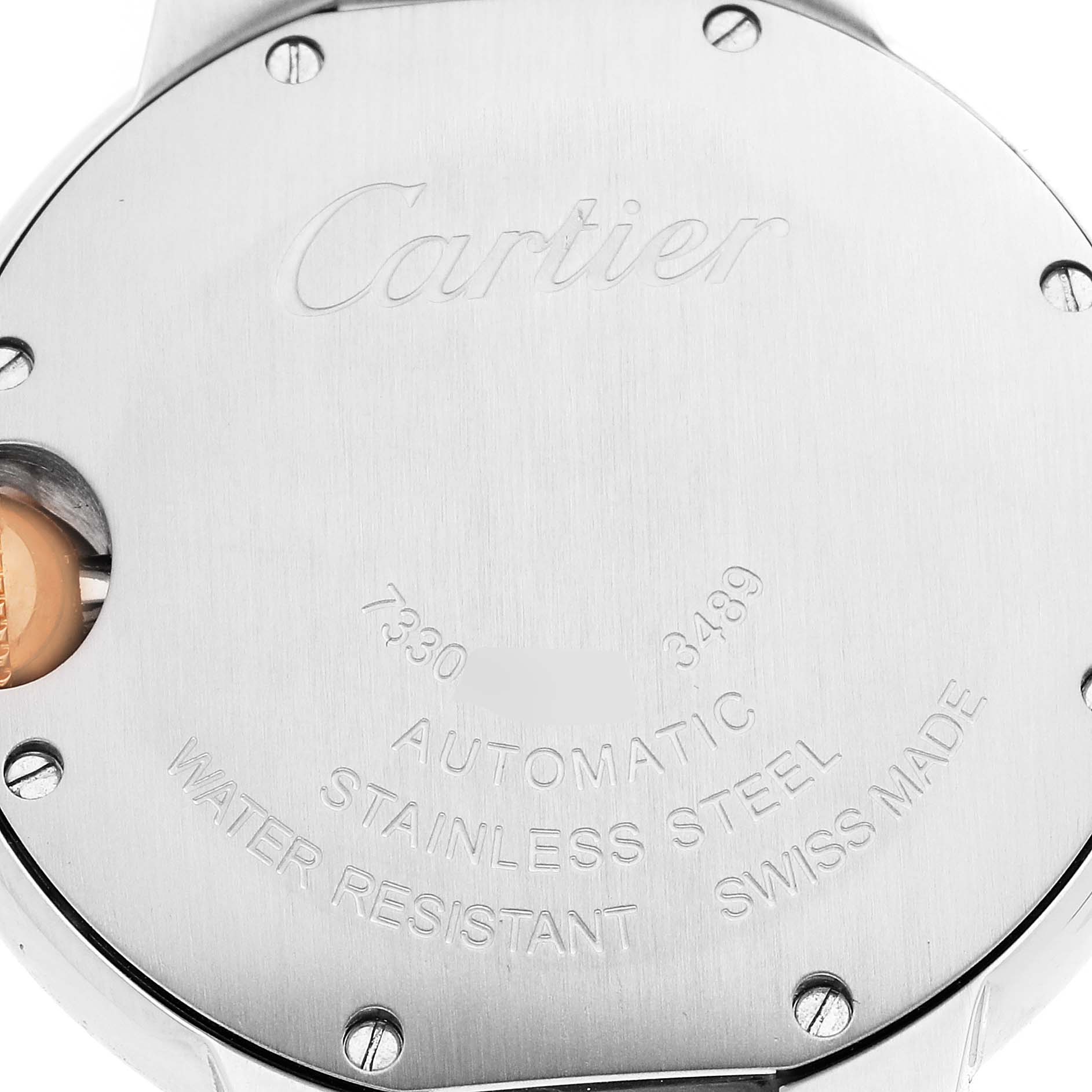 The image shows the back case of a Cartier Ballon Bleu WE902061 Women
s Stainless Steel Silver Dial WE902061 Women
s Stainless Steel Silver Dial watch, focusing on its engravings and stainless steel material.