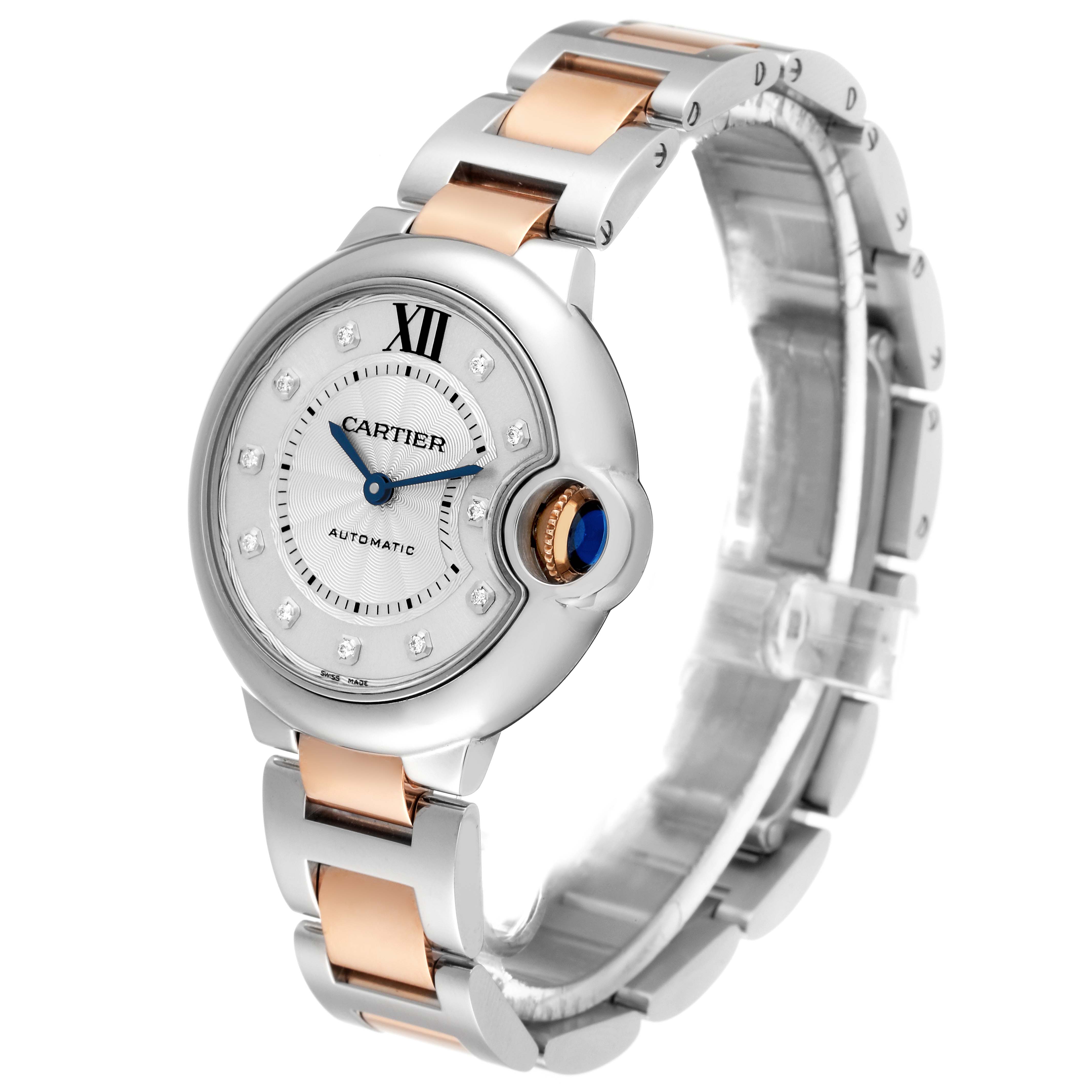 The image shows a Ballon Bleu model by Cartier at a three-quarter angle, highlighting the face, blue crown, and two-tone metal band.