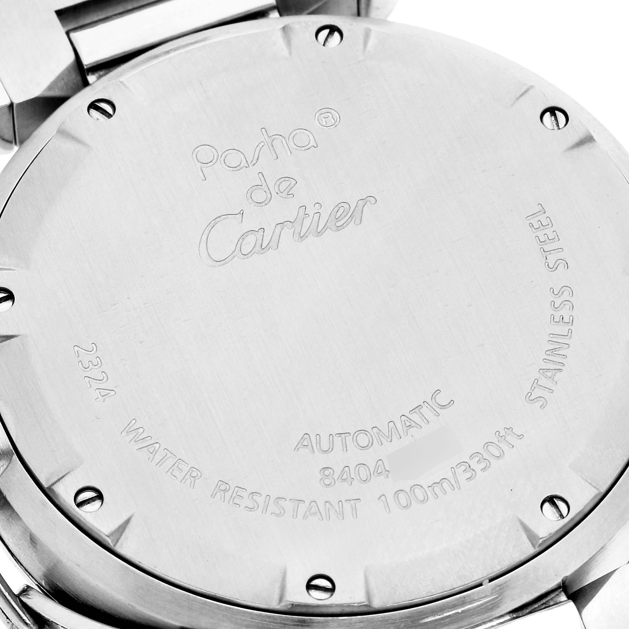 The image shows the back of a Cartier Pasha W31076M7 Women's Stainless Steel Black Dial W31076M7 Women's Stainless Steel Black Dial watch, highlighting the inscription details and stainless steel case.